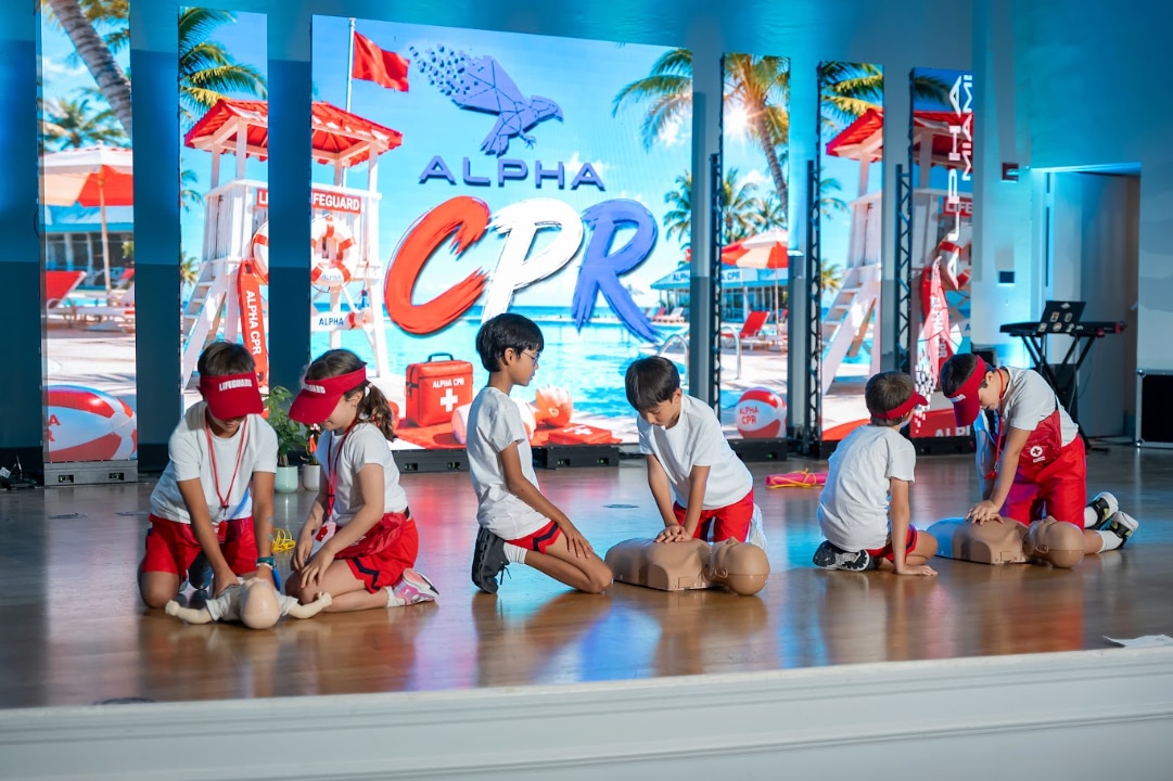 Alpha School students are showing the the skills they learned during a CPR workshop.