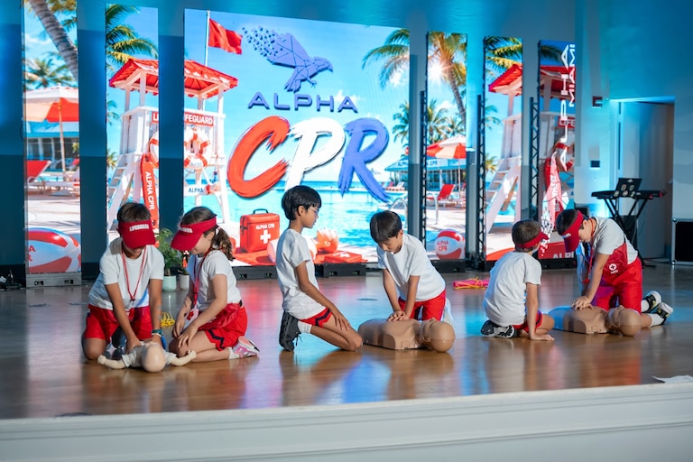 Alpha School students are showing the the skills they learned during a CPR workshop.