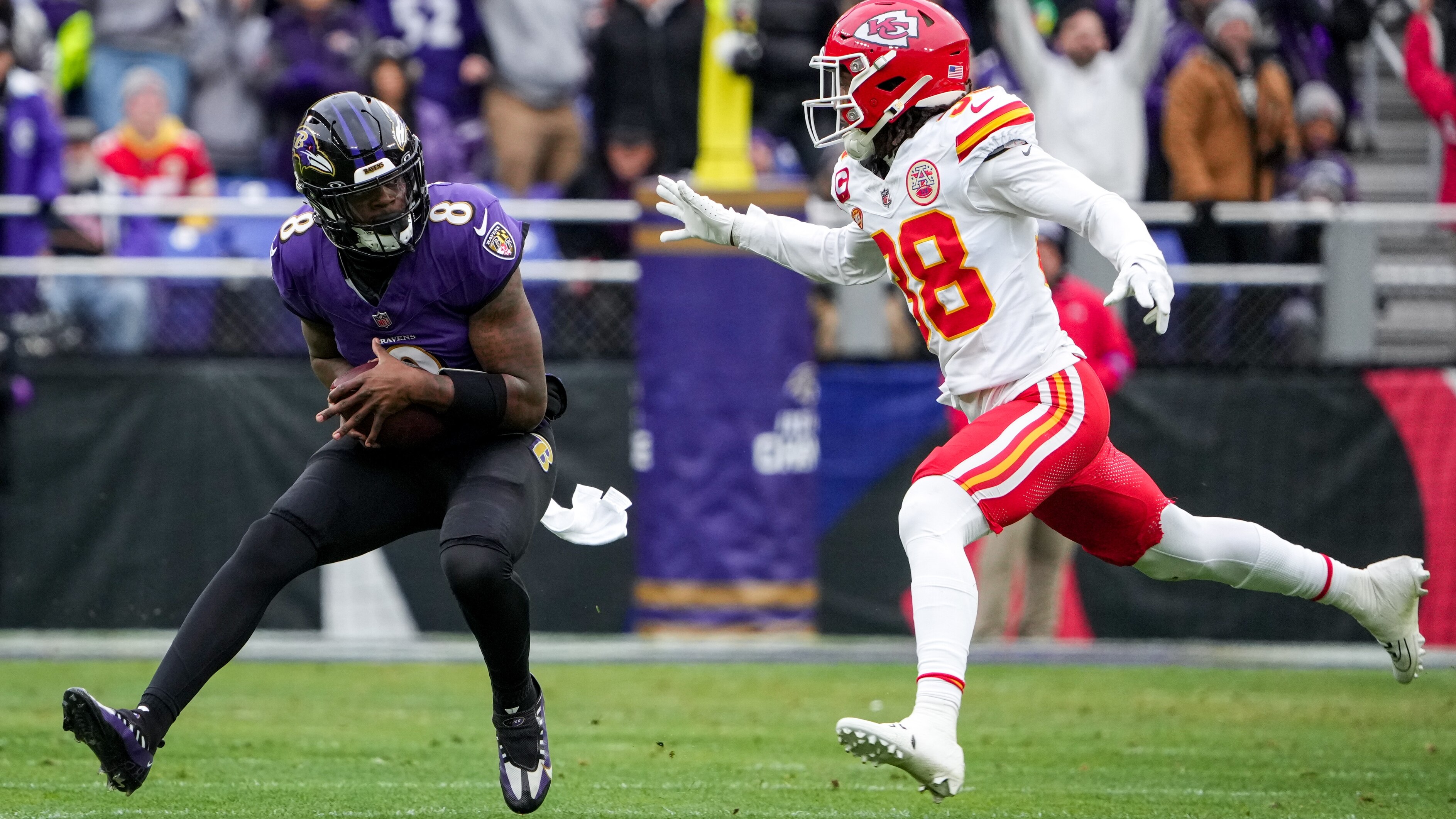 Baltimore Ravens quarterback Lamar Jackson (8) scrambles forward with the ball in the first quarter of the AFC Championship game against the Kansas City Chiefs at M&T Bank Stadium on January 28, 2024. The Chiefs beat the Ravens, 17-10, to advance to the Super Bowl.