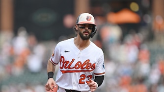 Orioles' Blaze Alexander jogs to home plate to score on a home run hit by Leody Taveras in Sunday's game against the Royals.