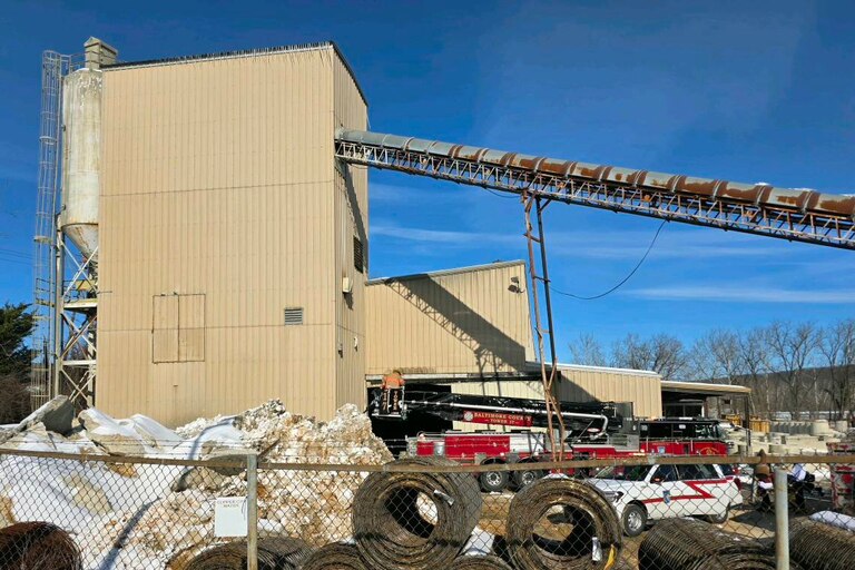 Baltimore County Fire crews work to rescue a person trapped in an elevated sand hopper in Cockeysville.