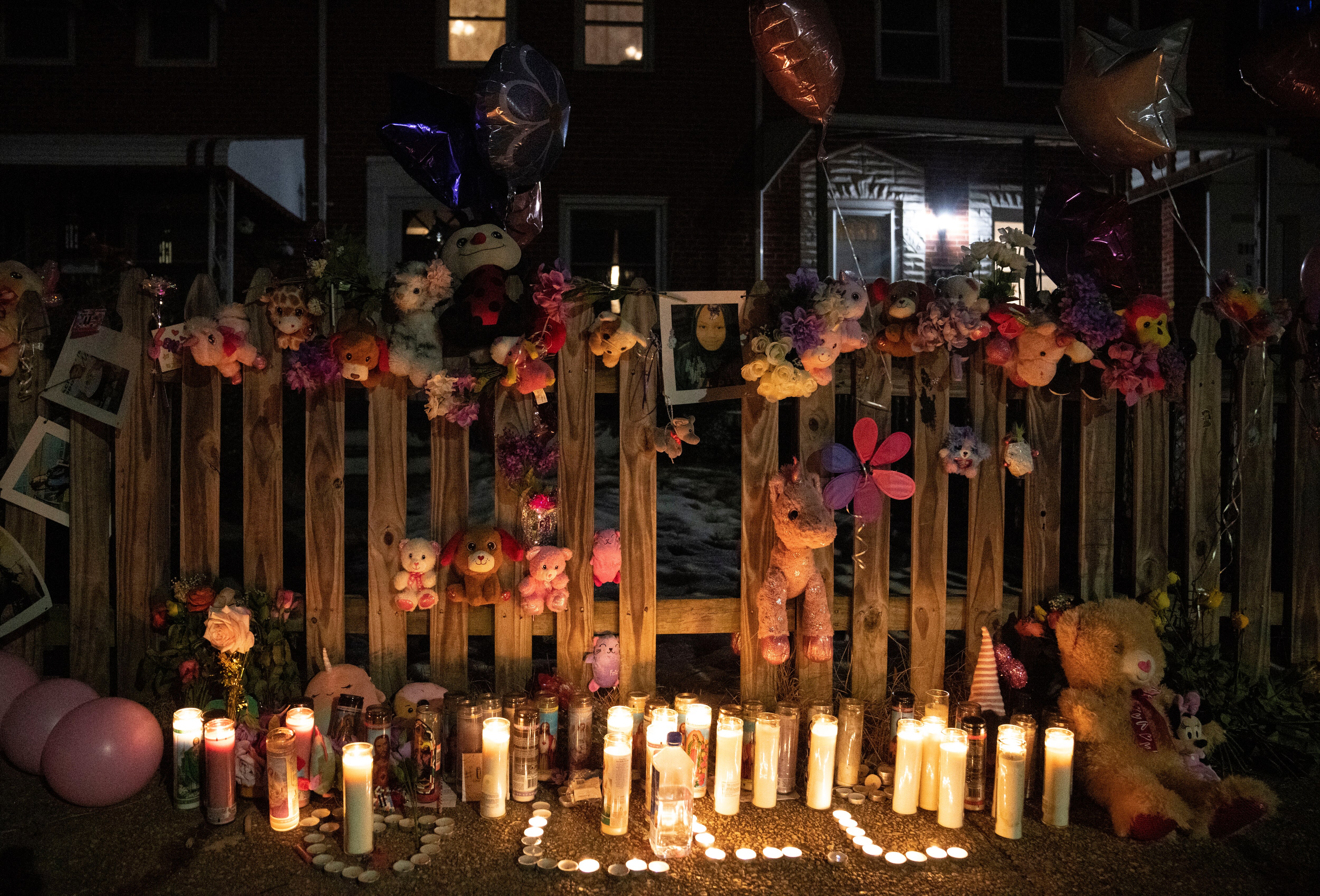 A memorial can be seen on a fence during the vigil held for 11-year-old London Olsen, in Essex, Tuesday, January 28, 2025.