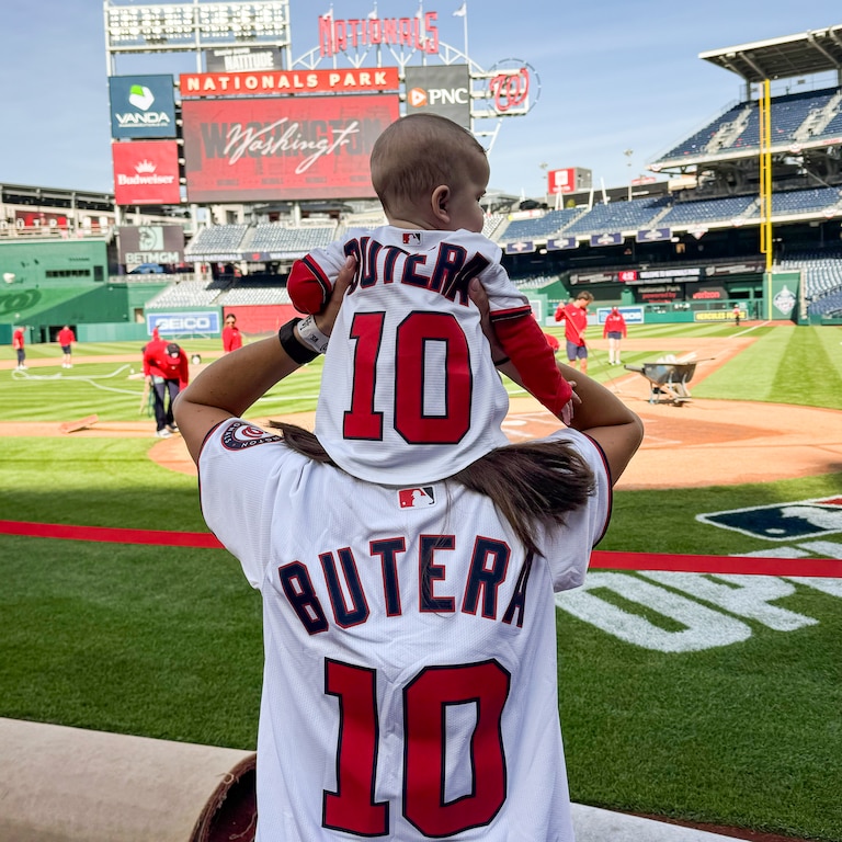 Caroline Margolis puts Blair Butera on her shoulders ahead of the Nationals' home opener.