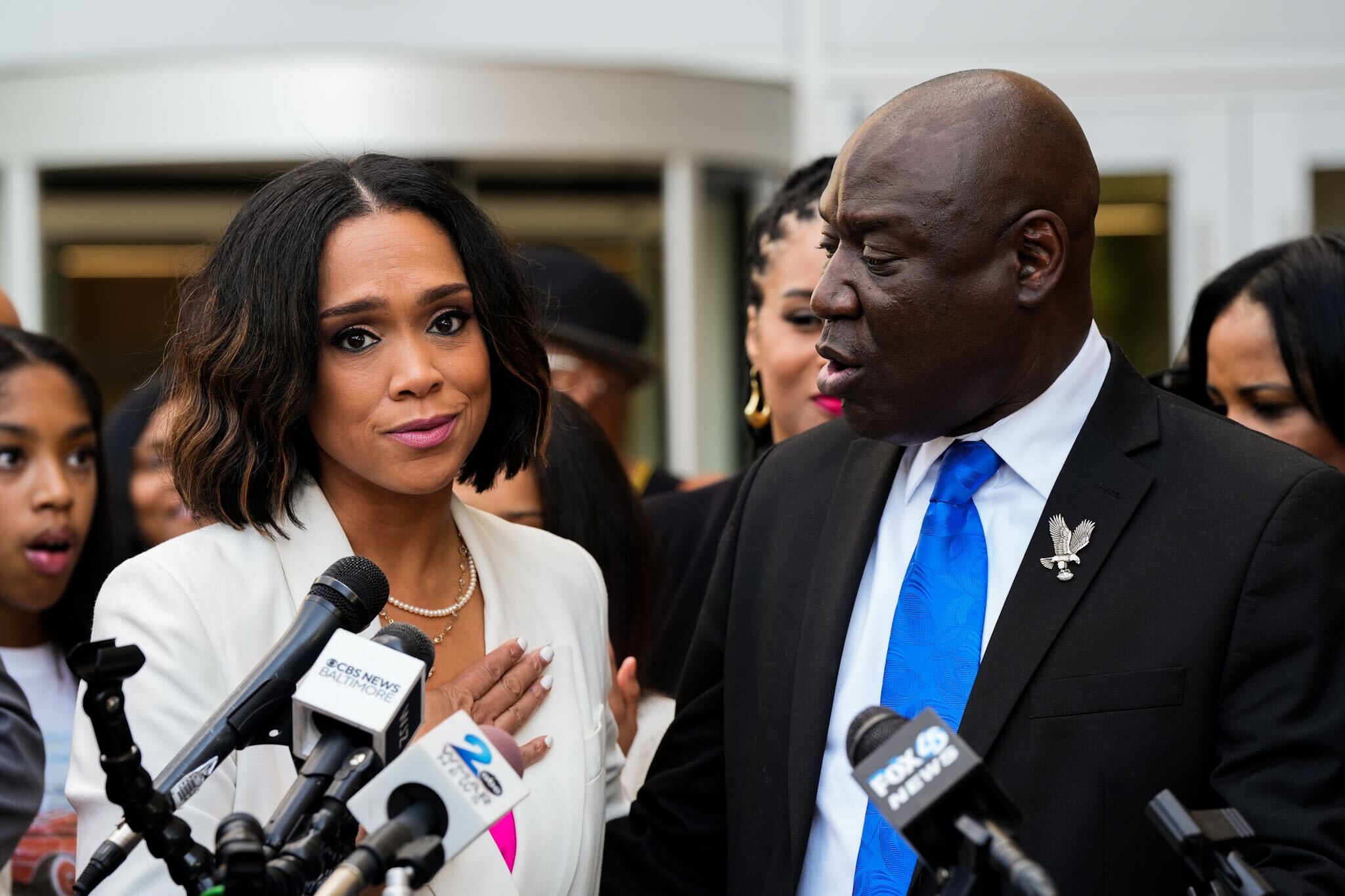 Former Baltimore State’s Attorney Marilyn Mosby, along with civil rights attorney Ben Crump, addresses reporters outside the federal courthouse in Greenbelt, May 23, 2024. Mosby was sentenced earlier in the day to three years of probation with a year of house arrest for perjury and fraud.