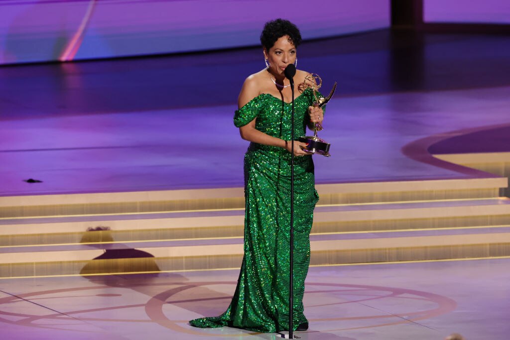 Liza Colón-Zayas, clad in a Christian Siriano design, accepts the Emmy for her role in “The Bear.”