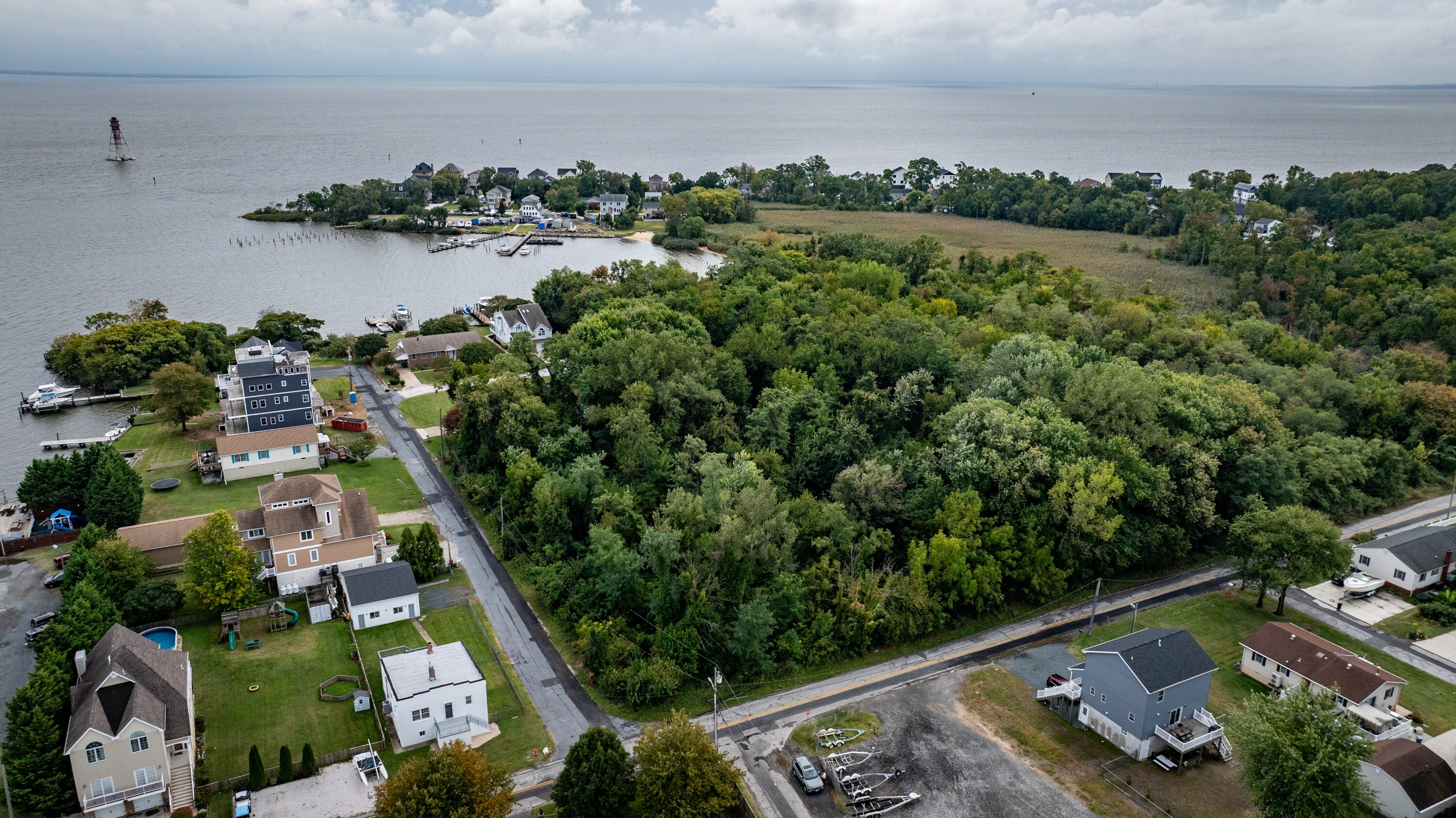 Baltimore County purchased the wooded area on Cuckold Point Road for a park. The property is less than a mile from County Executive Johnny Olszewski Jr.’s house on Millers Island.