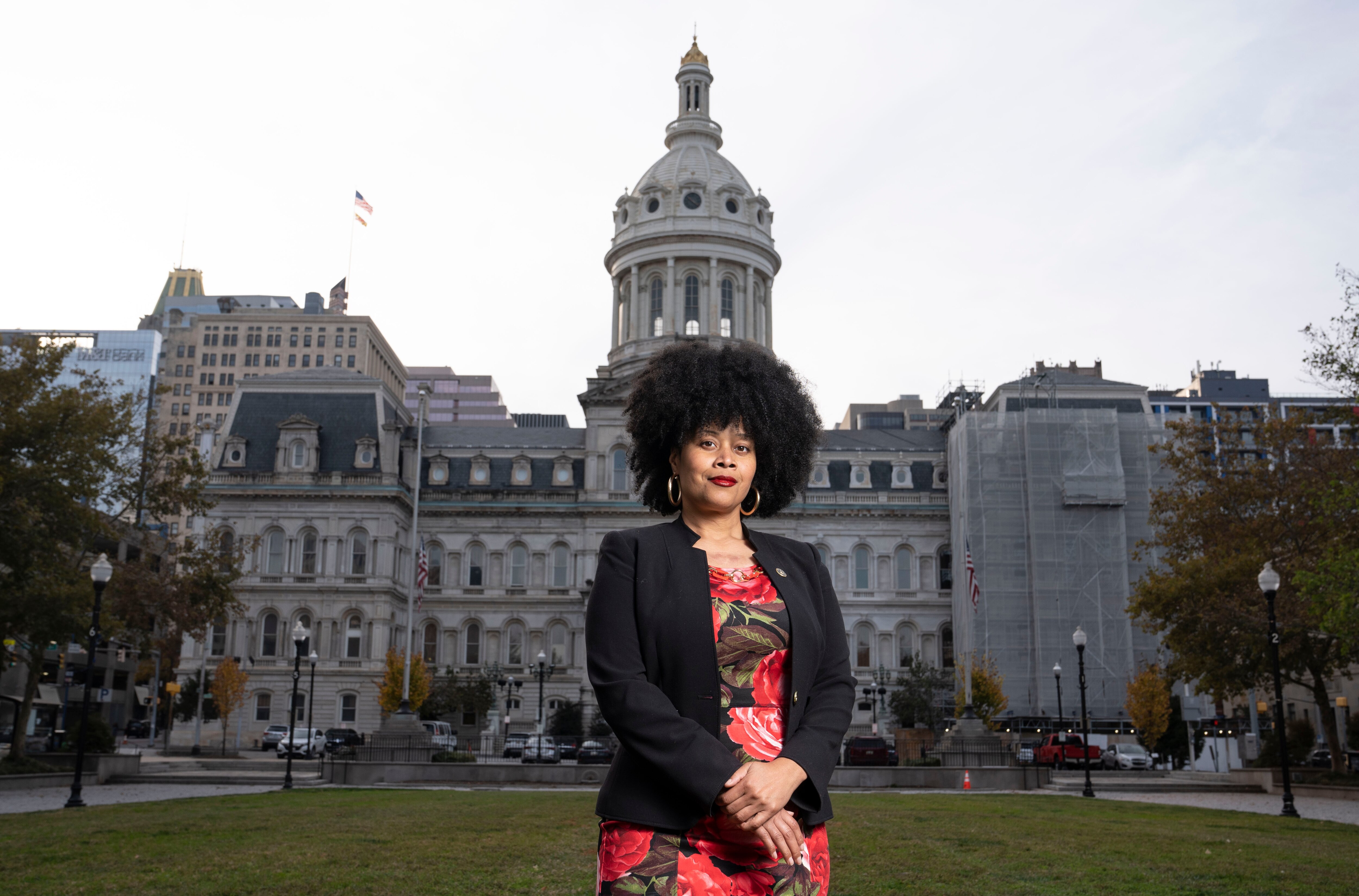 Kionne T Abdul-Malik, chairperson of the women's commission, poses for a portrait in front of City Hall in Baltimore, Monday, Nov. 6, 2023.
