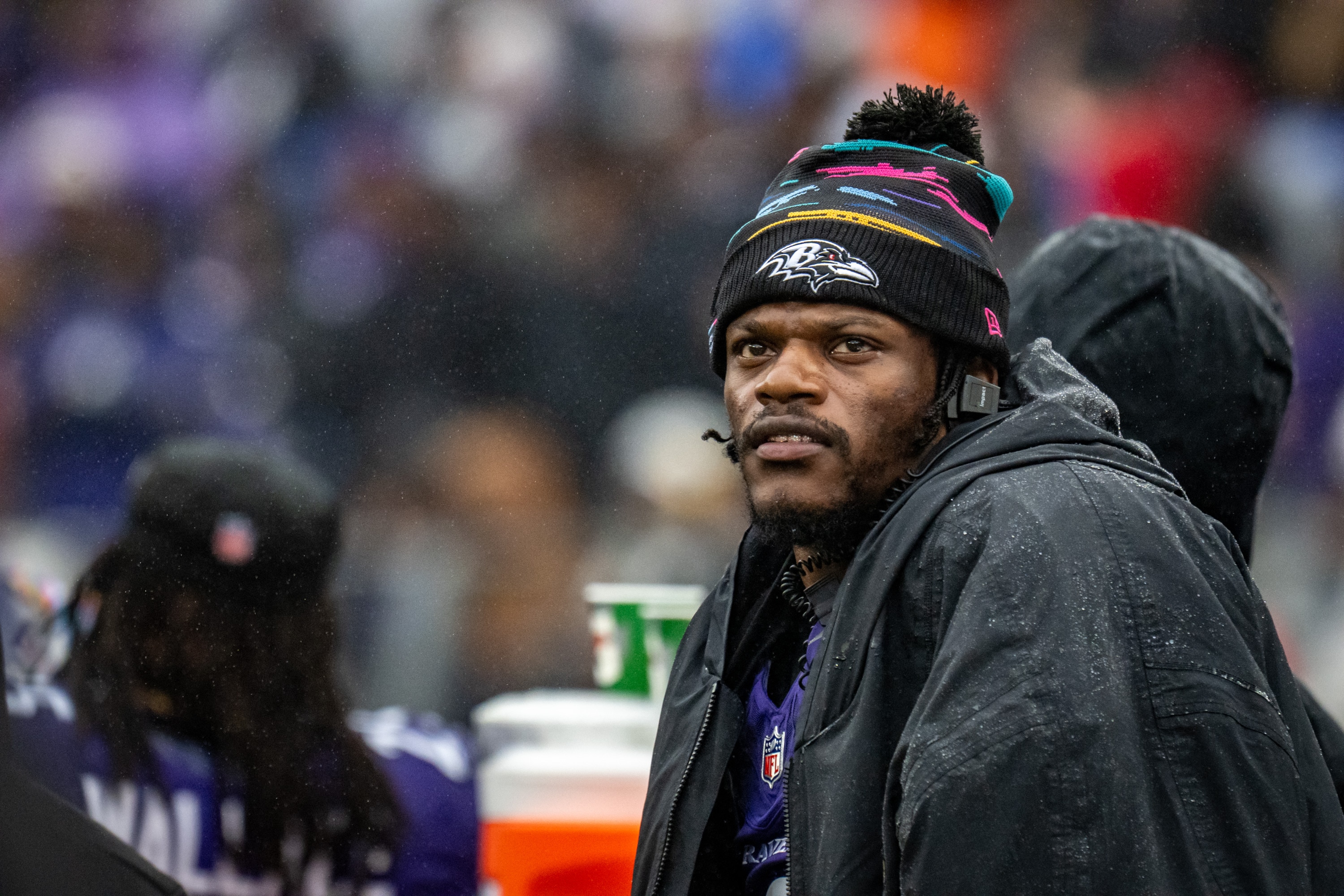 Ravens quarterback Lamar Jackson watches a replay of quarterback Tyler Huntley’s 9-yard run in the third quarter of the team's win over the Tennessee Titans.