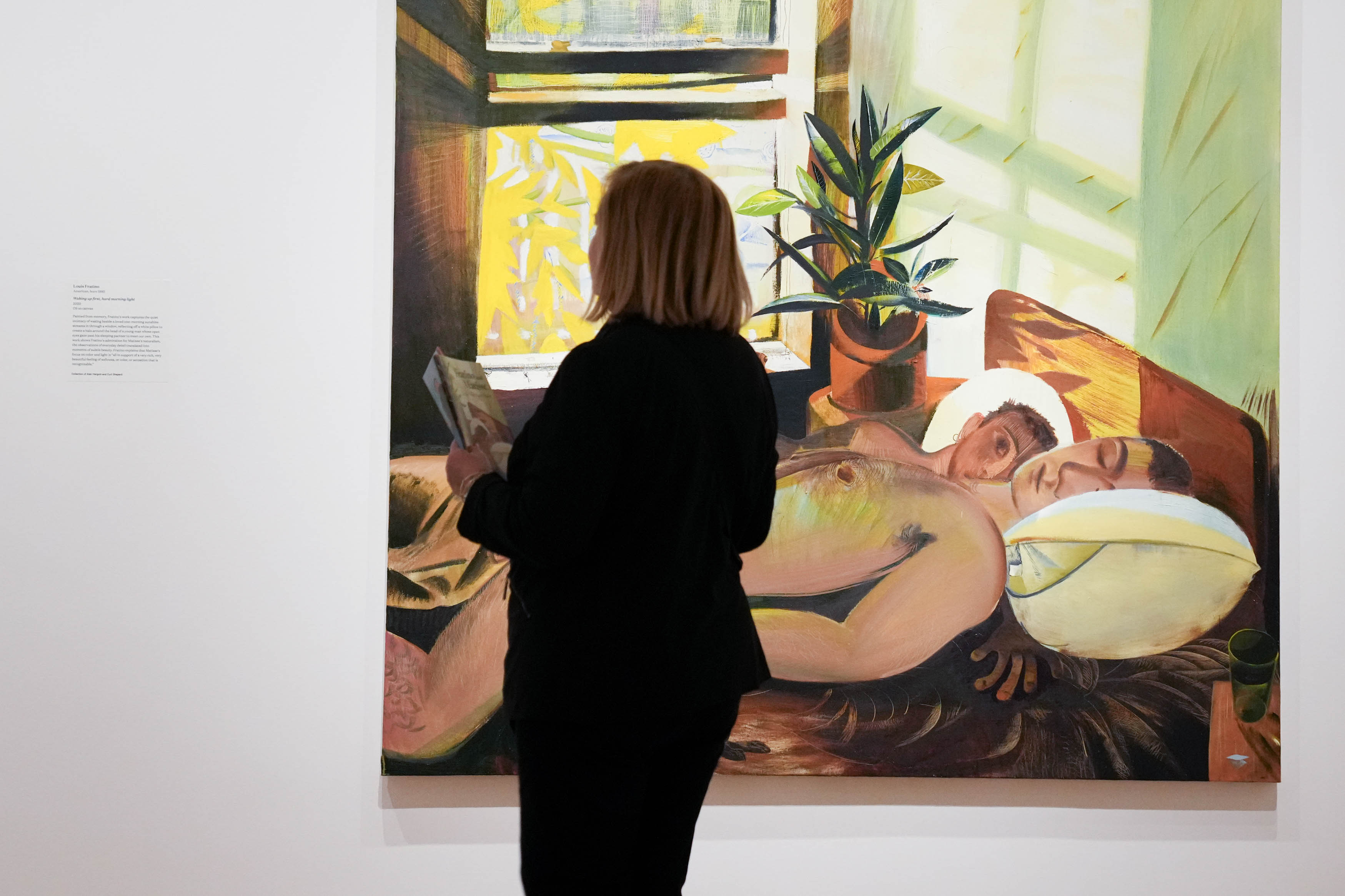 A Baltimore Museum of Art visitor examines “Waking up first, hard morning light” by Louis Fratino on March 13.