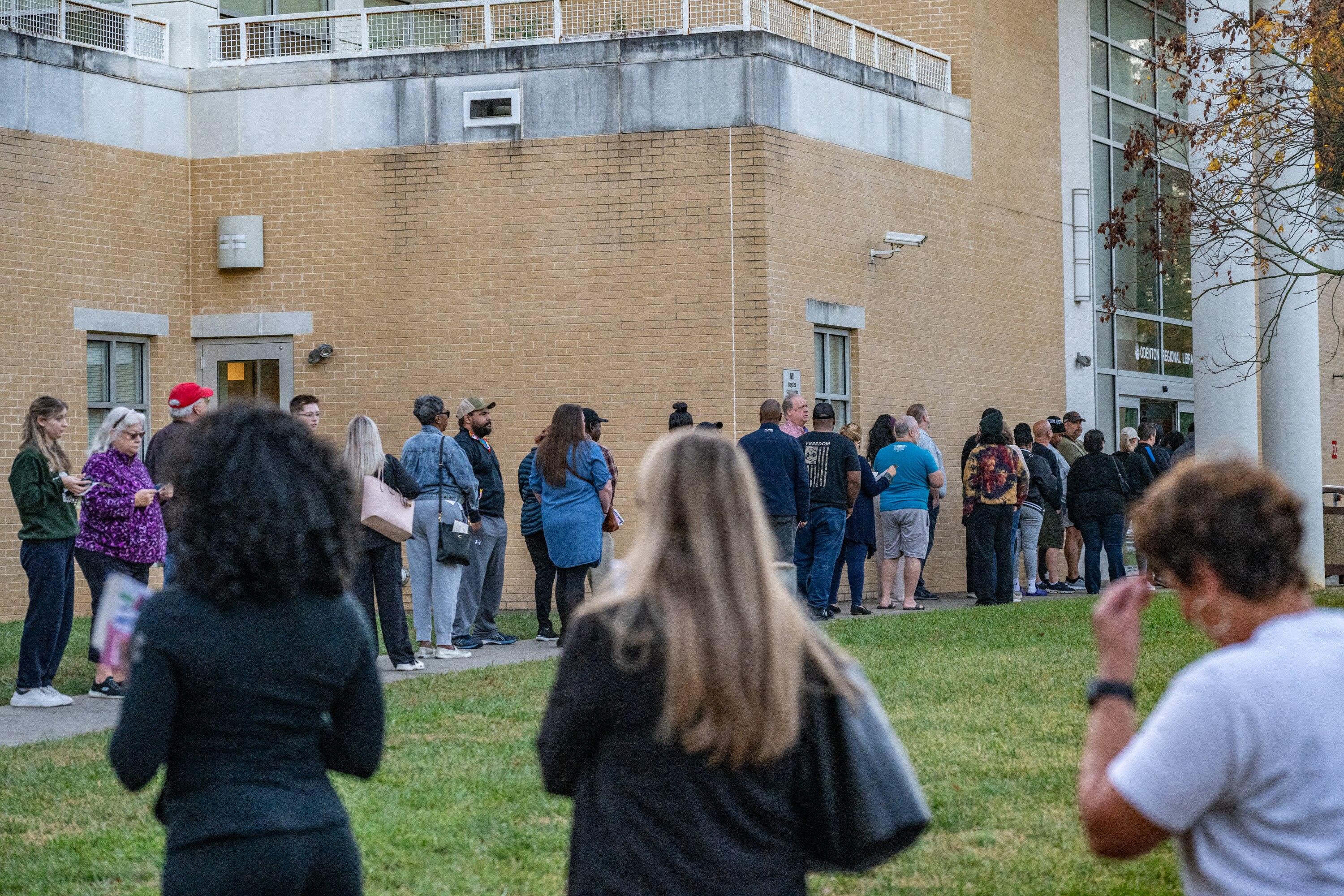 Voters line up outside the Odenton Public Library Thursday, October 31, 2024, on the last day of early voting in the general election.
