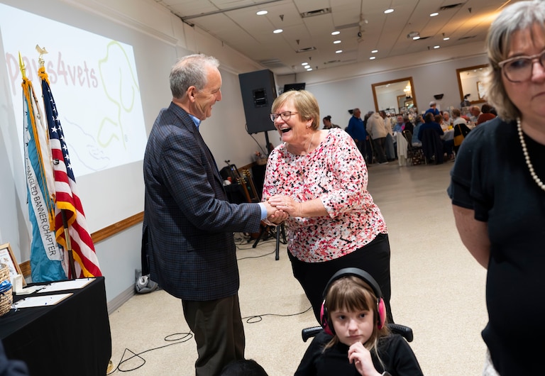Republican candidate for Baltimore County Executive Pat Dyer attends a fundraiser for Paws4Vets Foundation. He shakes hands with friend Rita Kurek.