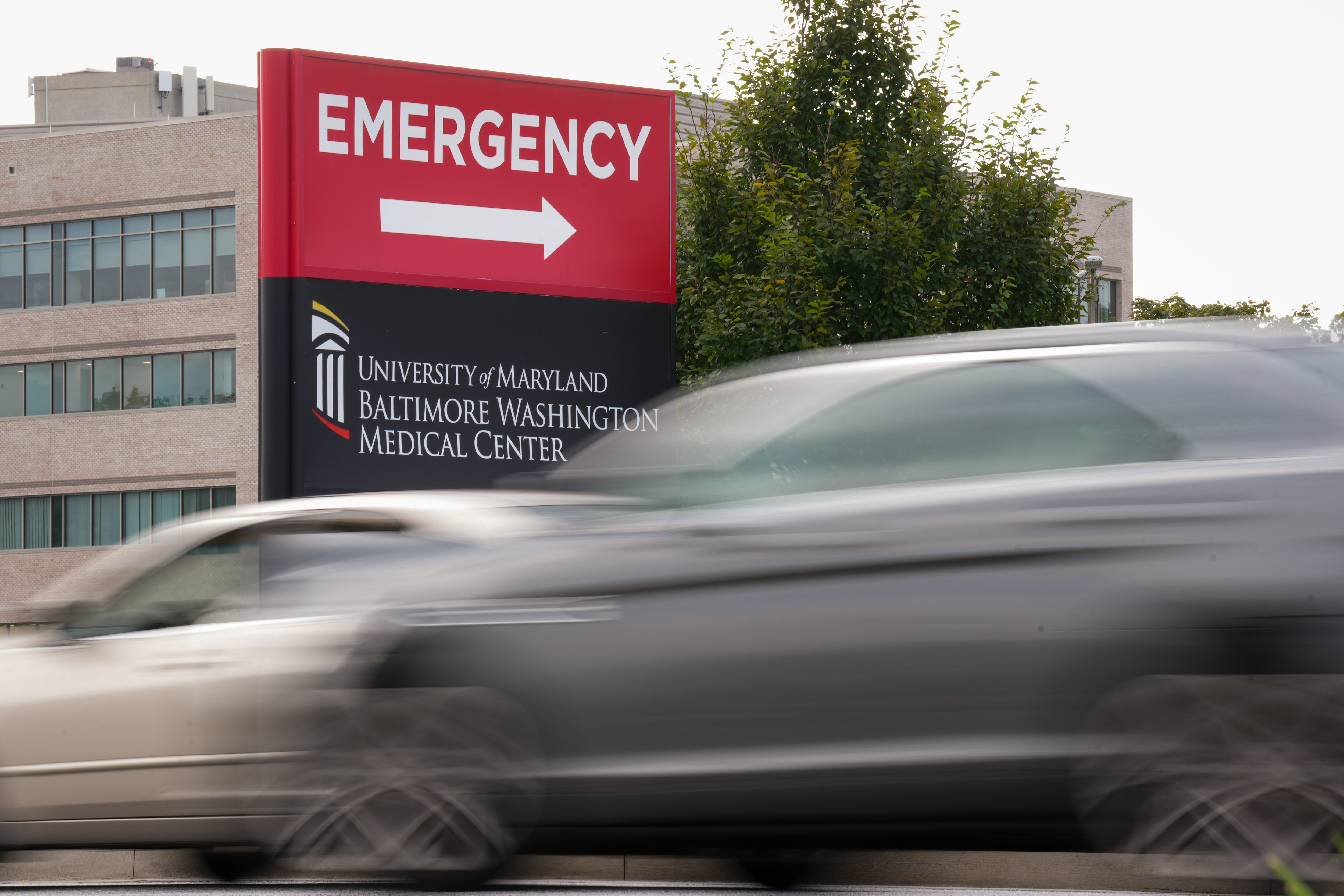 Cars drive past the emergency room sign at the University of Maryland Baltimore Washington Medical office in Glen Burnie on Friday, Oct. 4, 2024.