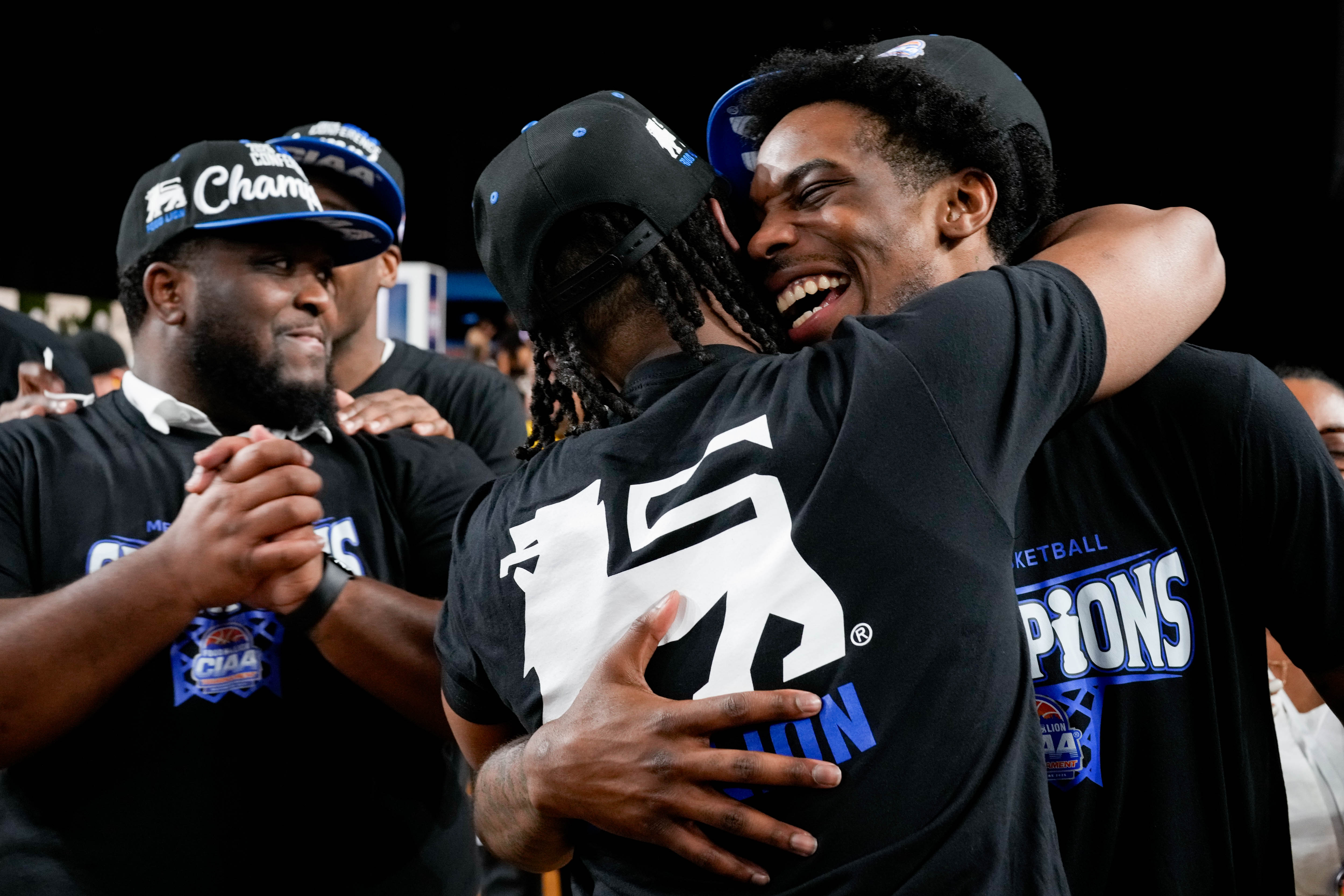 Fayetteville State’s Ezekiel Cannedy, right, embraces a teammate following the victory over Bluefield State in the CIAA men’s championship game in Baltimore on Saturday.