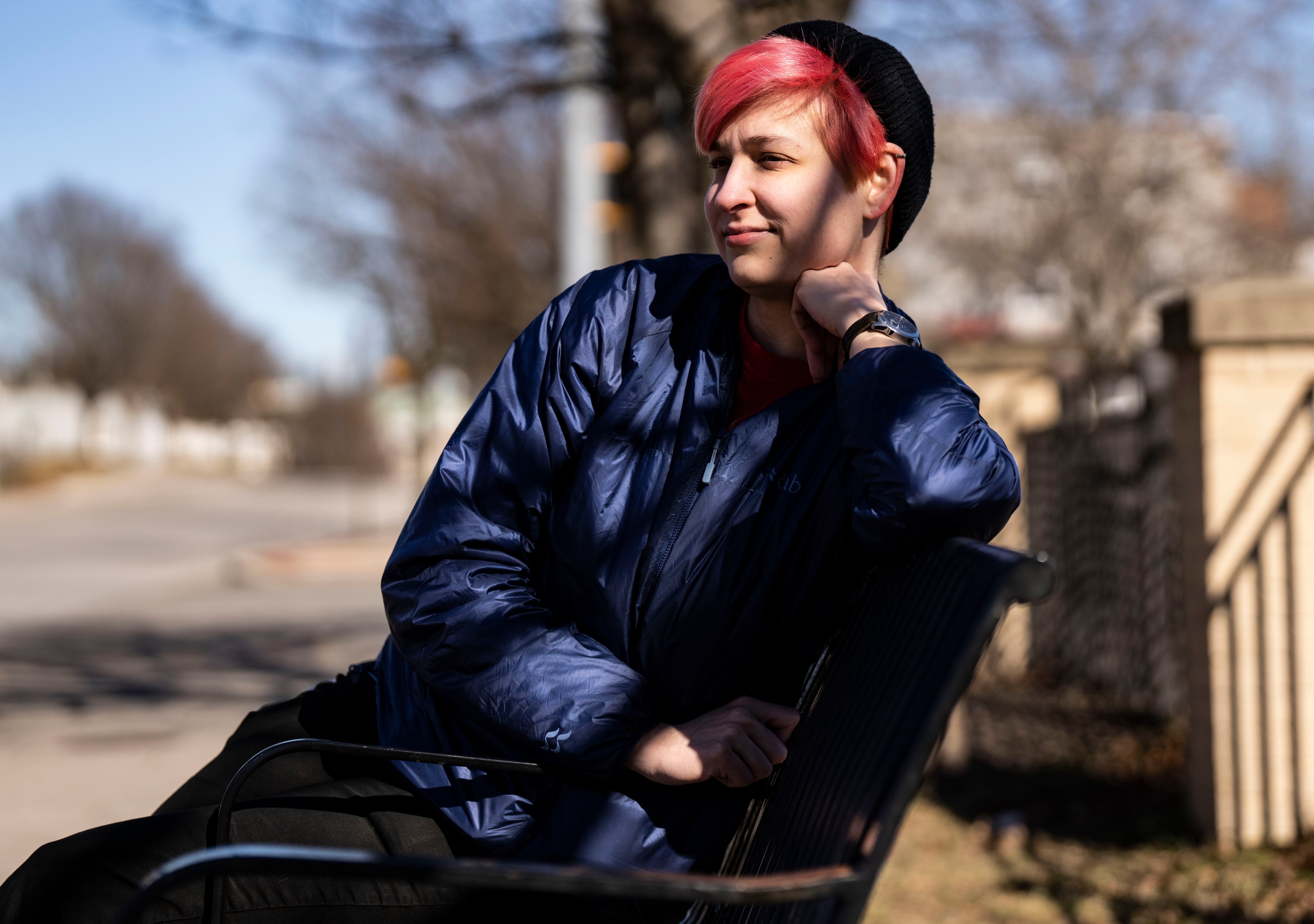 Charlie Amiot sits on a bench at a bus stop, in Baltimore, Saturday, February 4, 2023.