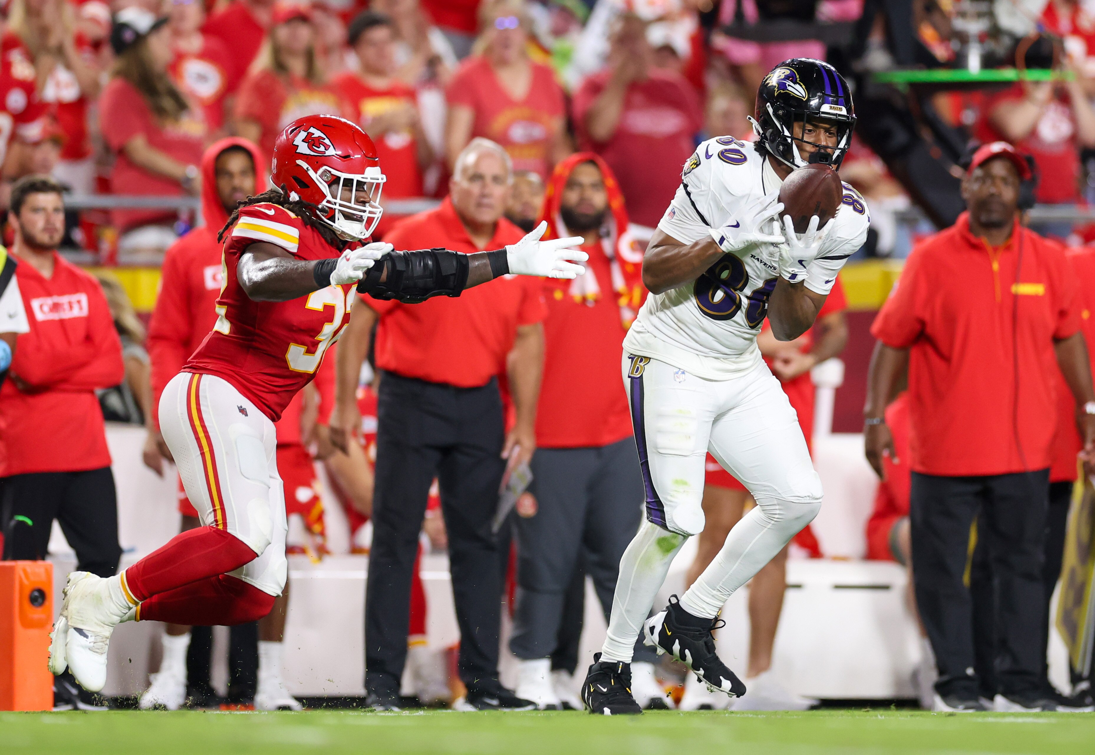 Ravens tight end Isaiah Likely, who will play Sunday at Kansas City, makes a touchdown reception against Nick Bolton of the Chiefs last season.