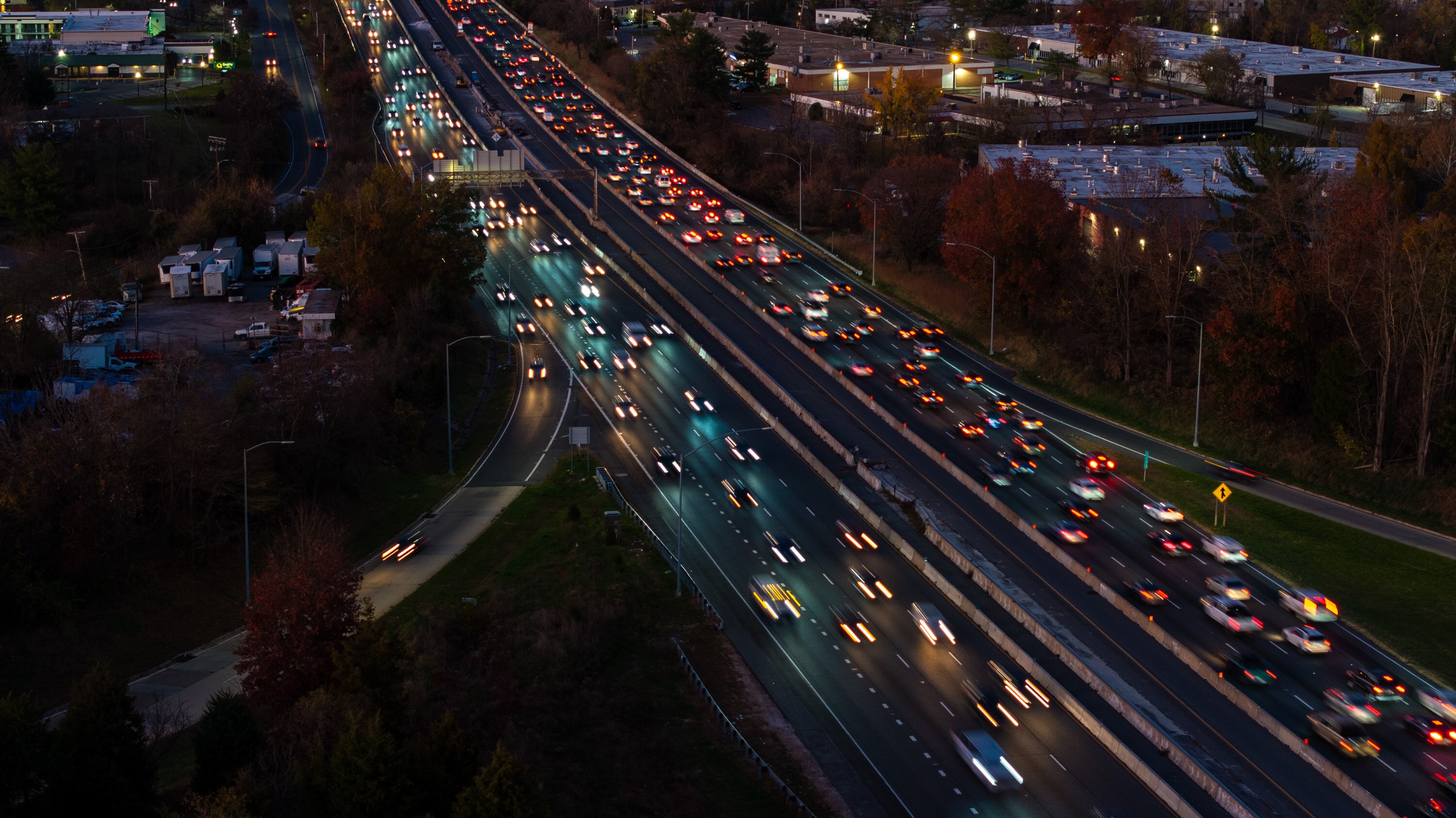 Rush hour traffic travels on I-695 near I-70 just after sunset.