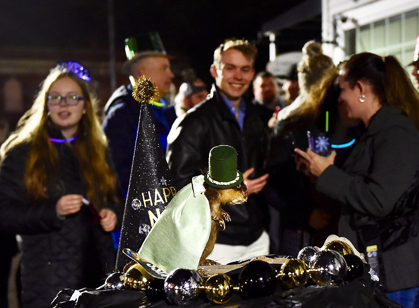 Large crowds gather in Princess Anne to see the city’s annual New Year’s Eve muskrat dive.
