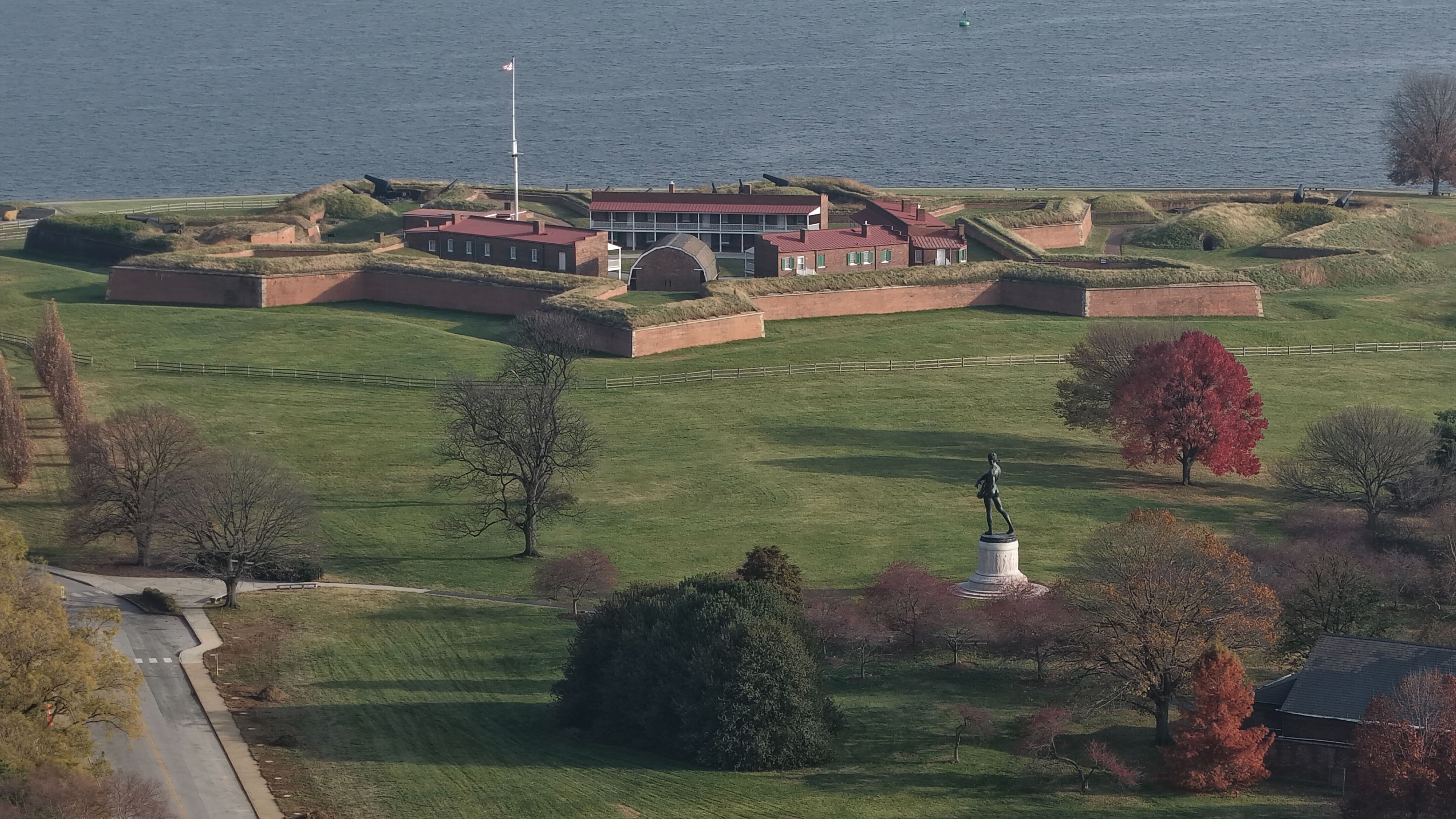 Baltimore Police block the road at East Fort Avenue leading to Fort McHenry on Friday, after sending its bomb squad as a safety measure after crews dug up an old explosive device.
