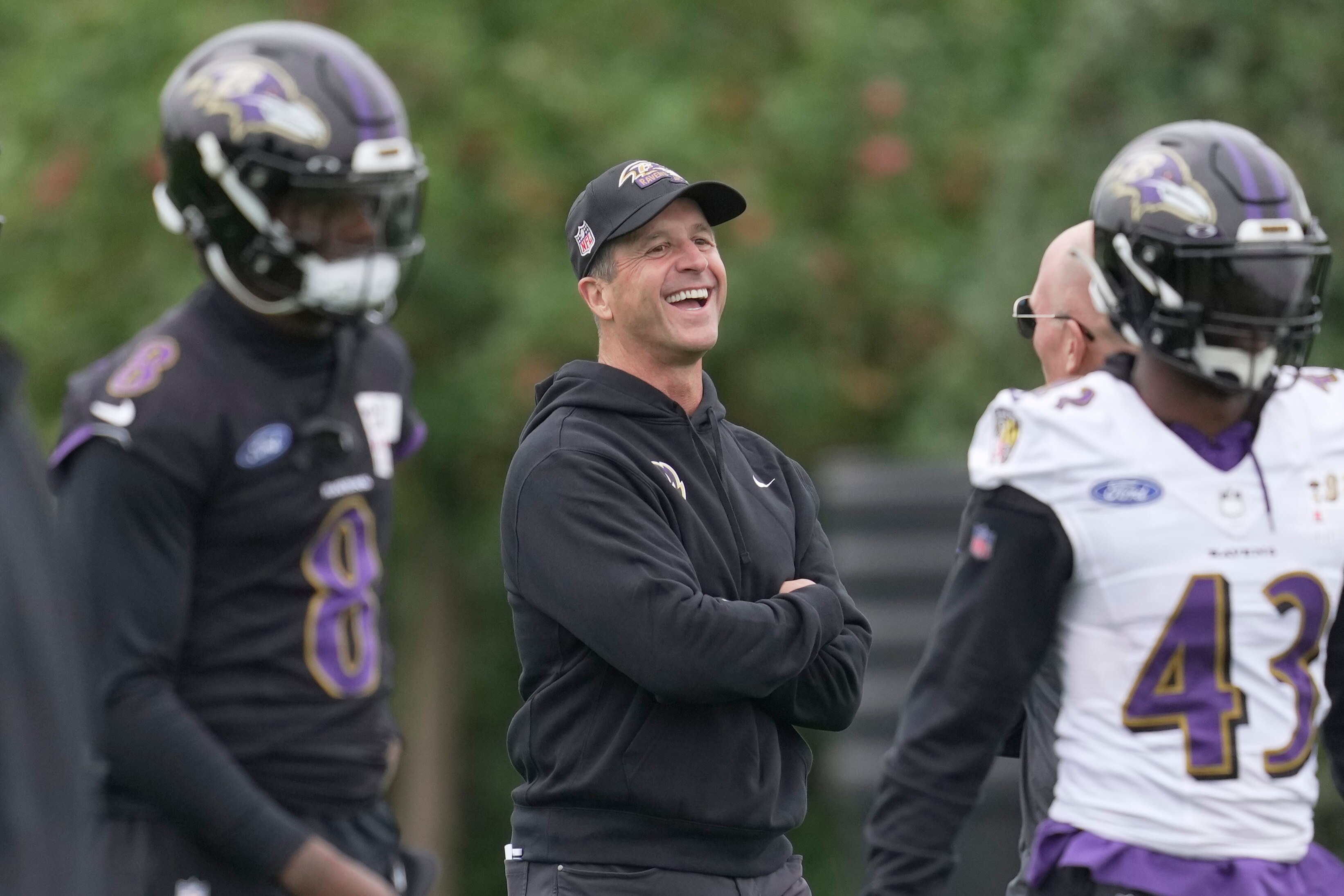 Baltimore Ravens head coach John Harbaugh, center, attends an NFL practice session in London, Thursday, Oct. 12, 2023 ahead the NFL game against Tennessee Titans at the Tottenham Hotspur Stadium on Sunday. (AP Photo/Kin Cheung)
