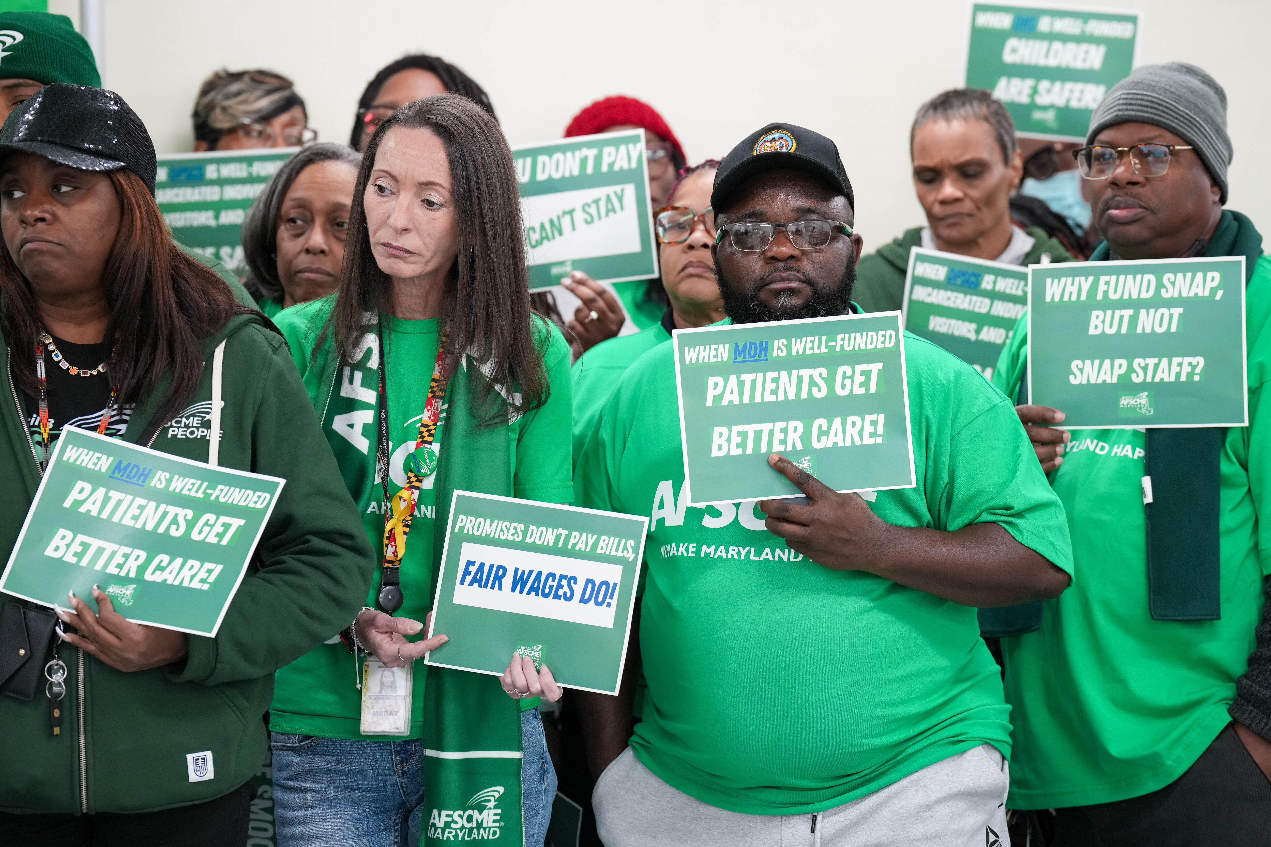 State workers who are members of AFSCME Maryland Council 3 hold a news conference in Baltimore in December to lodge concerns about Gov. Wes Moore’s administration. The administration and the union did not reach an agreement over wages for next year.