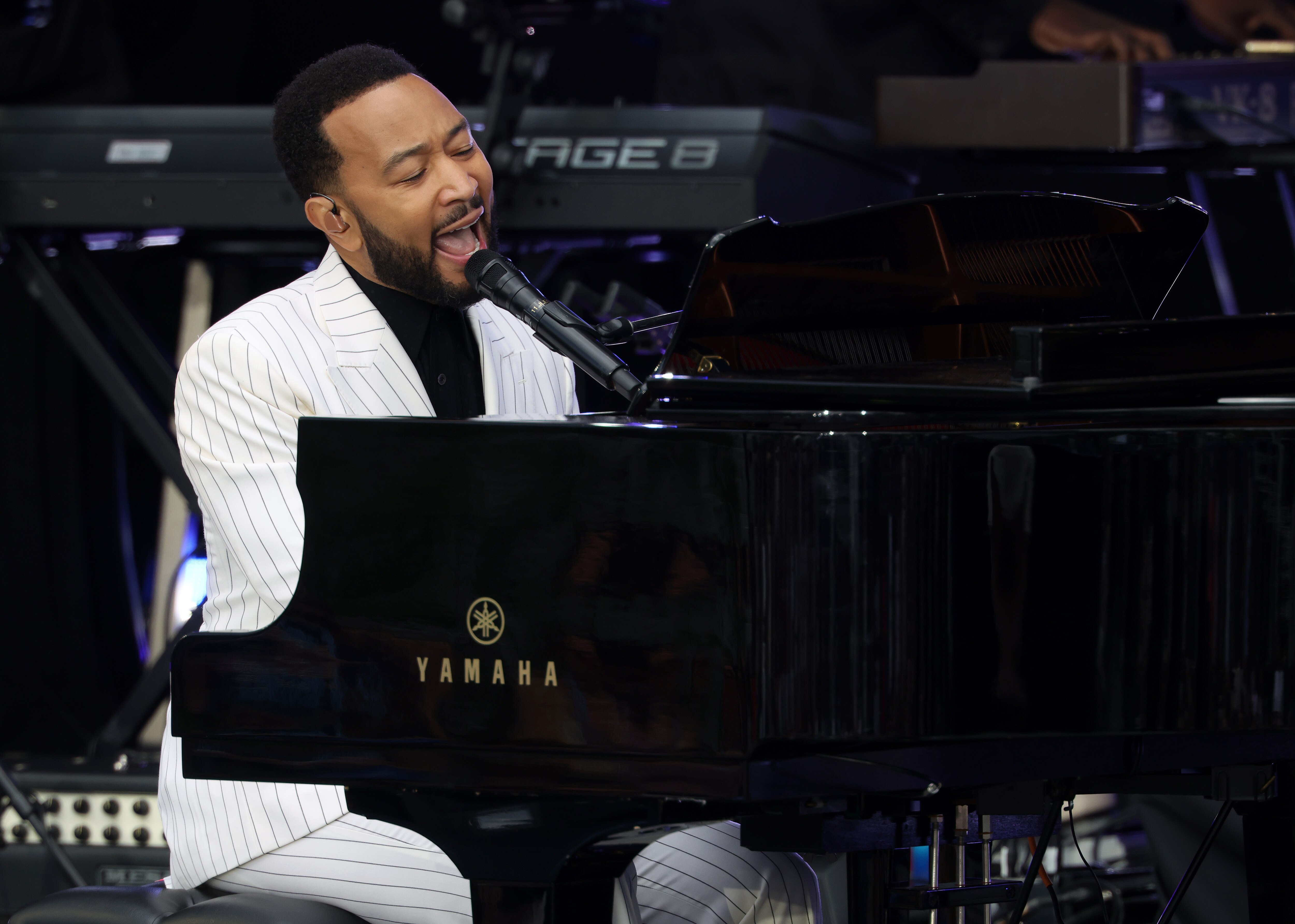 CHICAGO, ILLINOIS - JUNE 18: John Legend performs during the dedication ceremony for the opening of the Barack Obama Presidential Center in John Lewis Plaza on June 18, 2026 in Chicago, Illinois. Barack Obama served as the 44th president of the United States from 2009 to 2017 and was the first African American to hold the office. (Photo by Scott Olson/Getty Images)