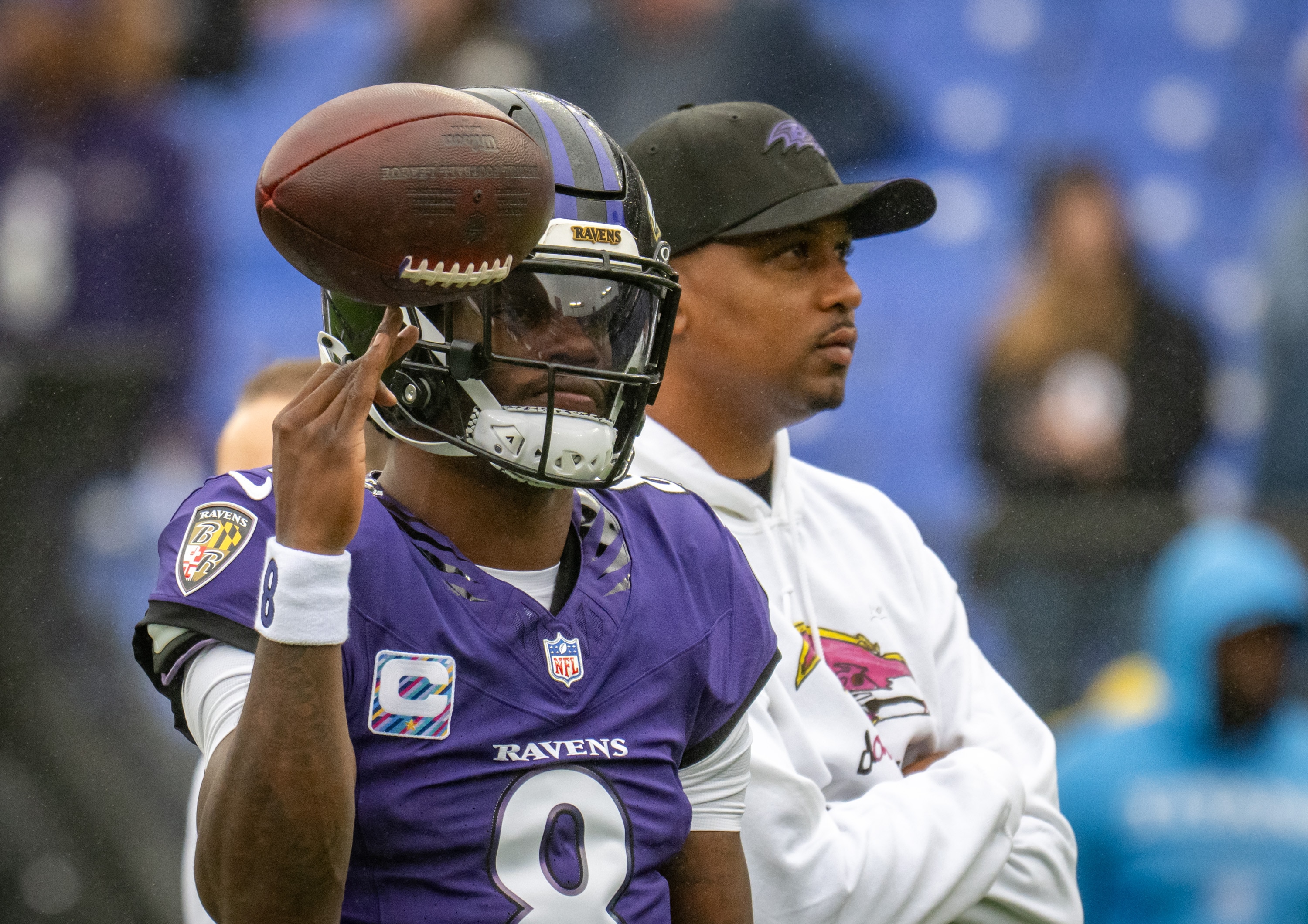 Ravens quarterback Lamar Jackson twirls the football during warmups before the team’s Week 4 game against the Tennessee Titans.