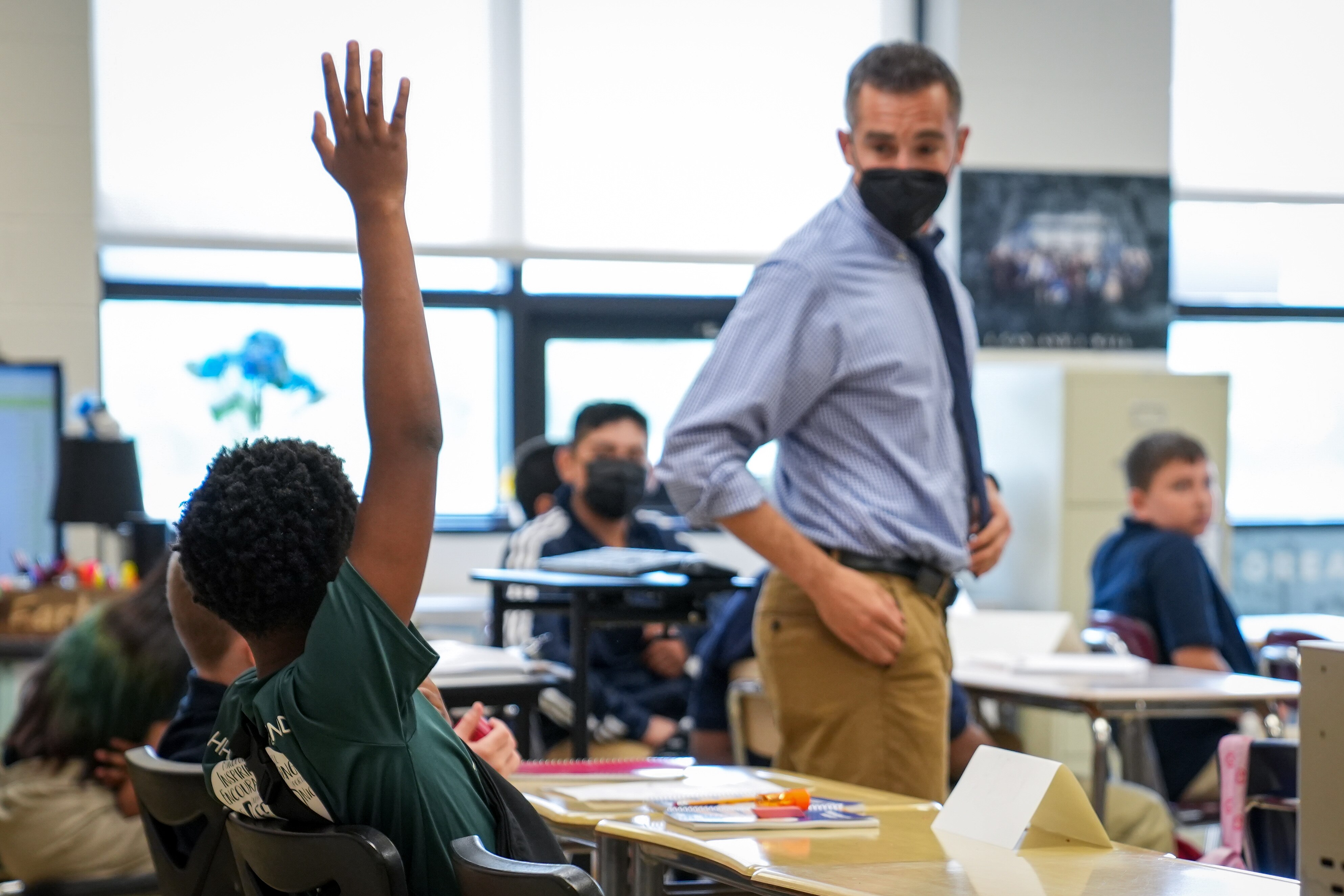 A student raises his hand to get his teacher’s attention inside Hampstead Hill Academy on 8/29/22. Monday was the first day back to school for Baltimore City students.