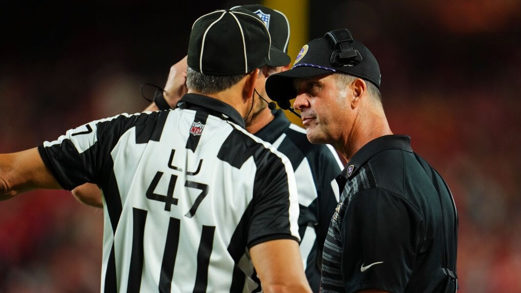 KANSAS CITY, MO - SEPTEMBER 05: Baltimore Ravens head coach John Harbaugh talks with the refs during an NFL football game against the Kansas City Chiefs at GEHA Field at Arrowhead Stadium on September 5, 2024 in Kansas City, California. (Photo by Cooper Neill/Getty Images)