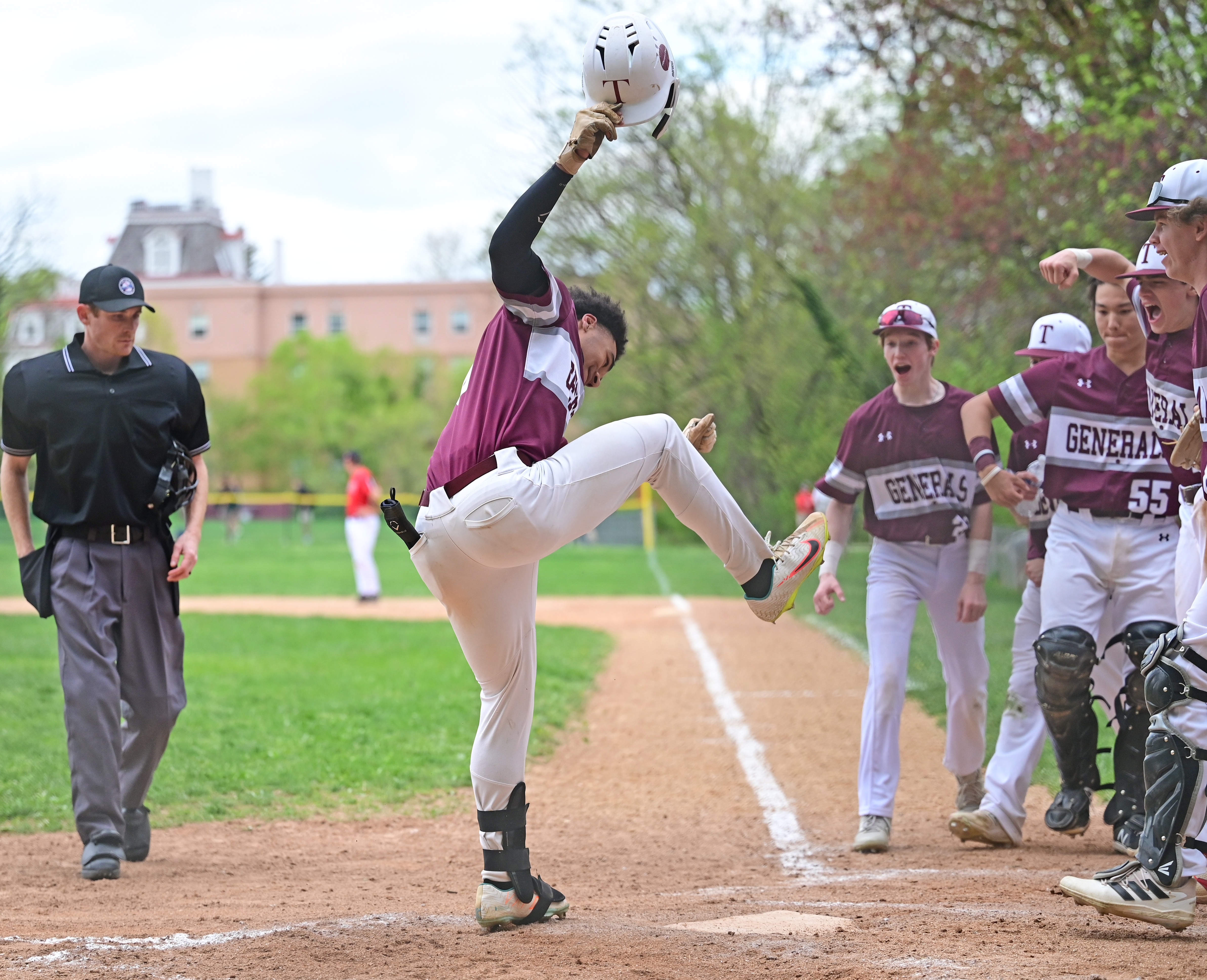 Towson's Aziz Bishop prepares to put his foot on home plate after his solo home run in the third inning Tuesday. The defending Baltimore County Division I champ Generals move a half-game ahead of Dulaney and Perry Hall for first with Tuesday's victory.