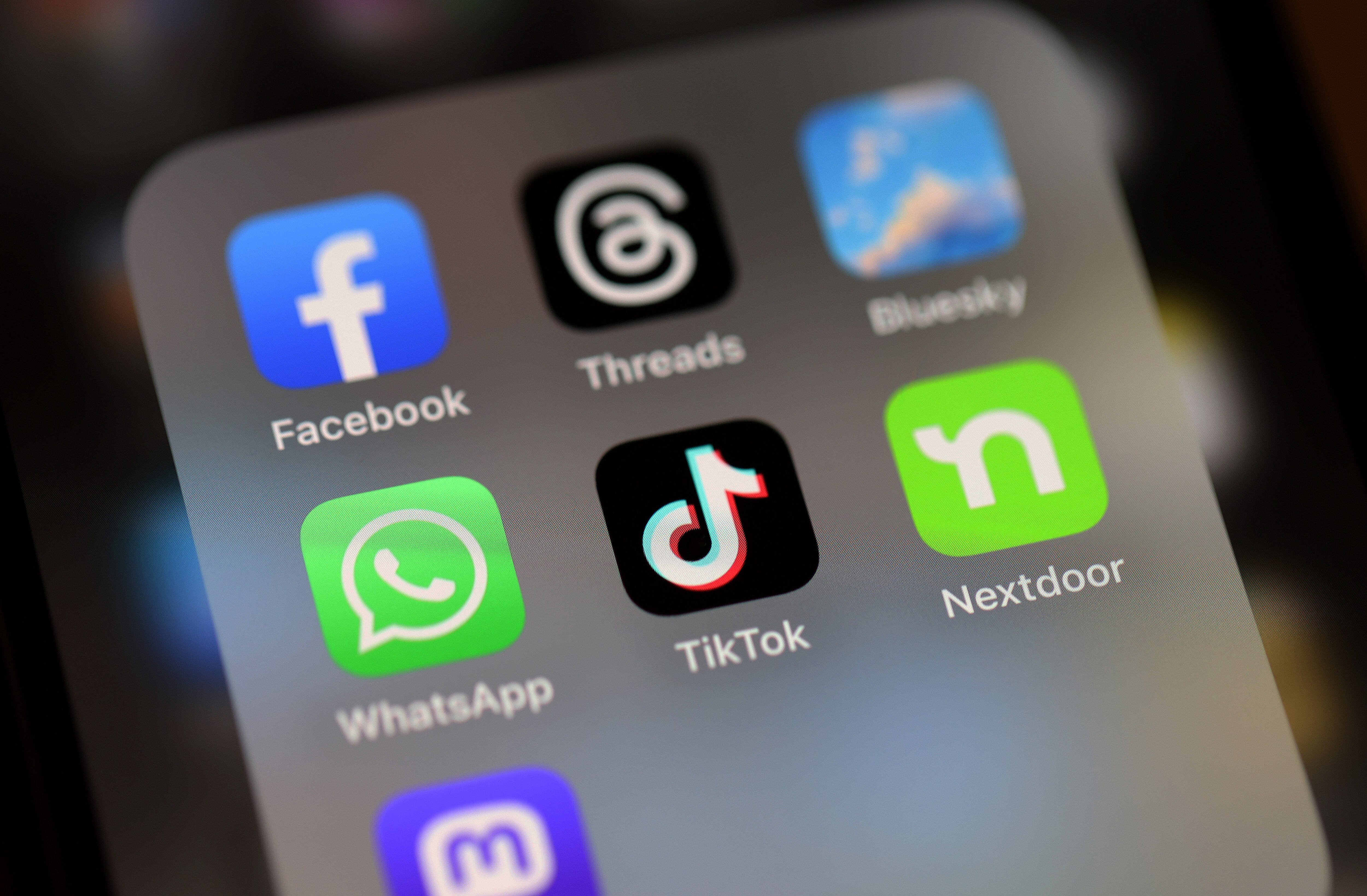 SAN ANSELMO, CALIFORNIA - DECEMBER 06: In this photo illustration, the TikTok logo is displayed on an iPhone screen on December 06, 2024 in San Anselmo, California. A three-judge panel of the U.S. Court of Appeals in Washington, D.C., has upheld a law mandating China-based ByteDance to sell the popular social media app TikTok or face a ban in the United States. ByteDance has until January 19, 2025 to sell the company. (Photo Illustration by Justin Sullivan/Getty Images)