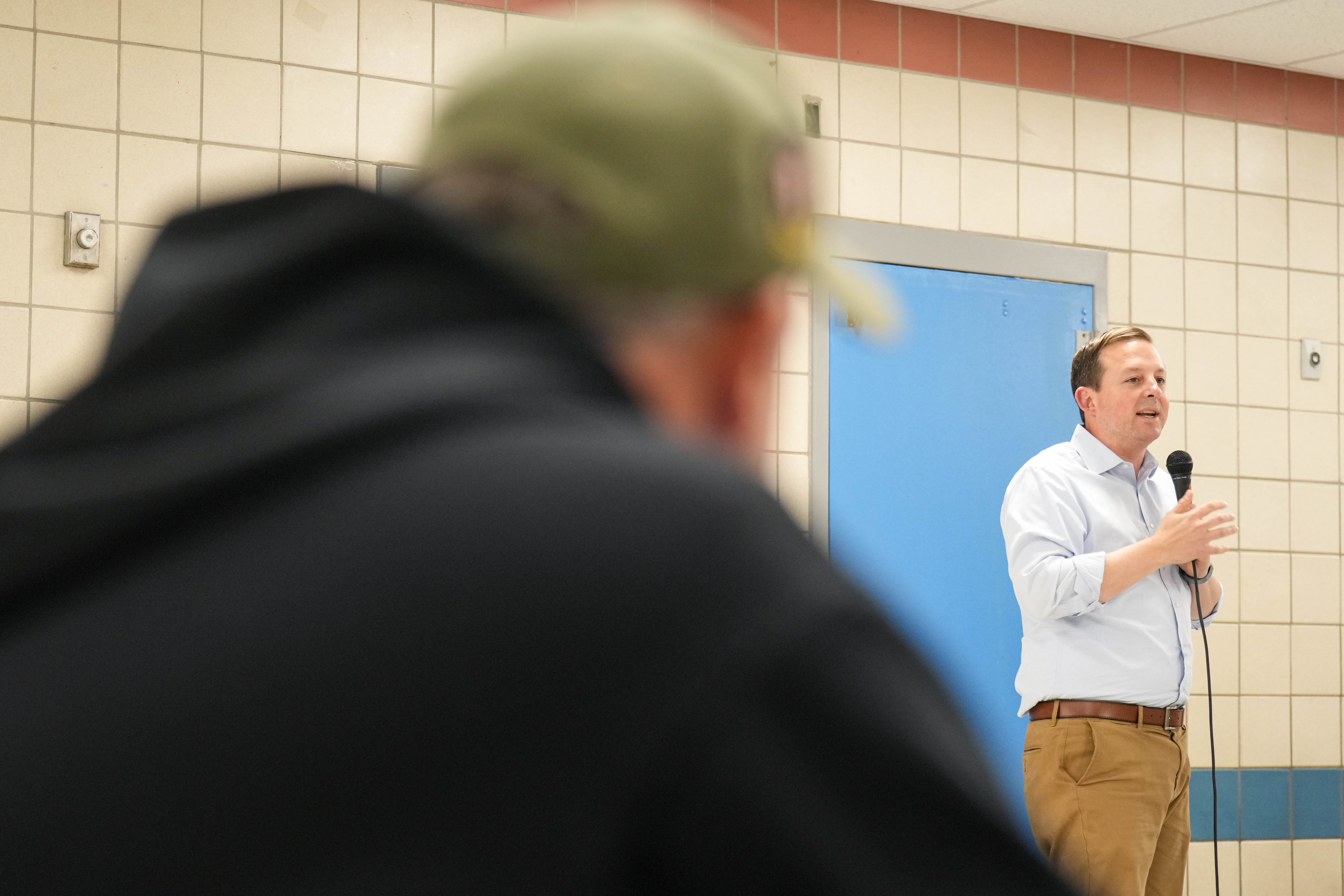 Bobby LaPin watches as Maryland Senate President Bill Ferguson, his opponent in the upcoming election, speaks at a Locust Point Civic Association forum in Baltimore earlier this month.