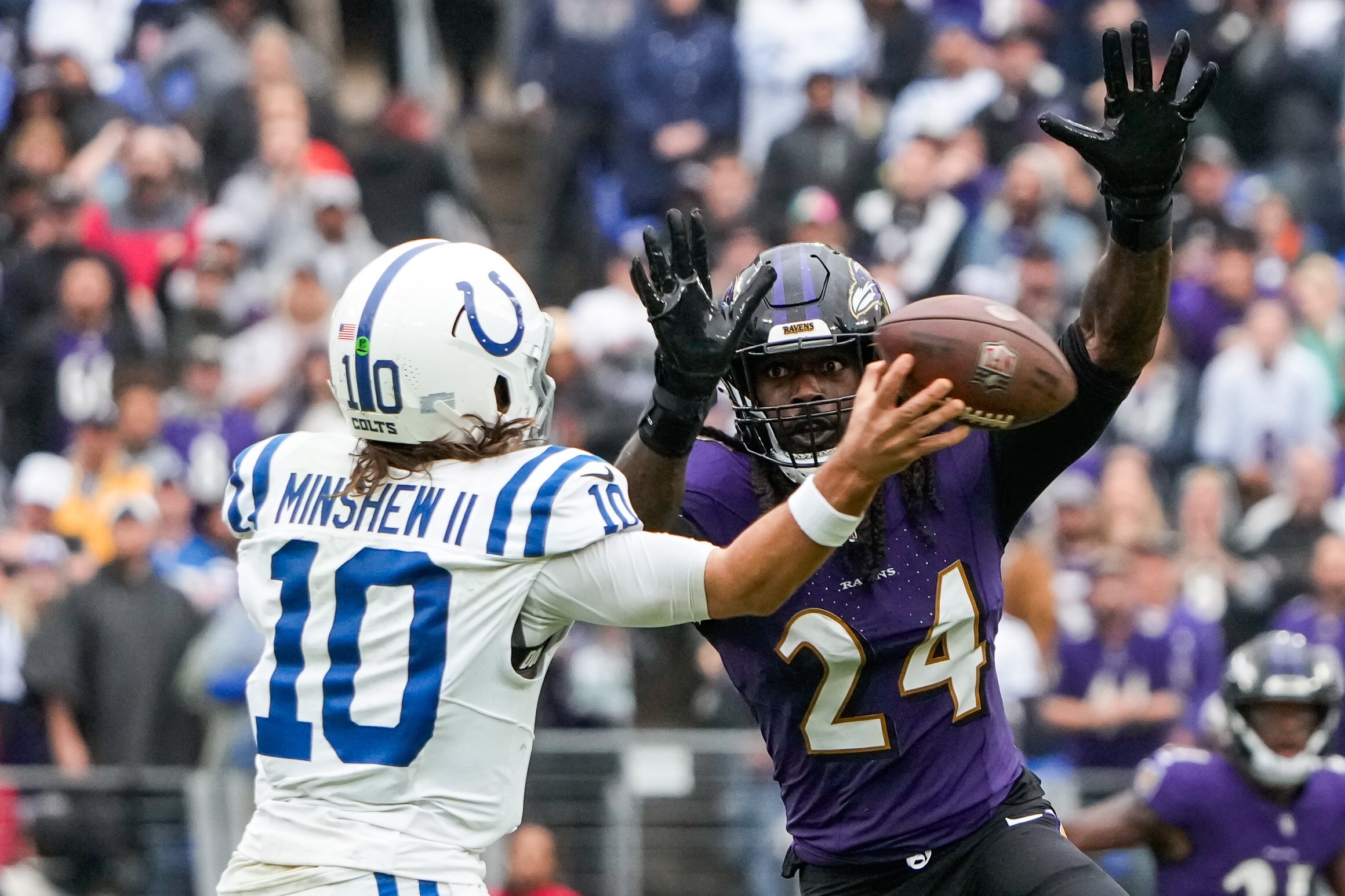 Ravens outside linebacker Jadeveon Clowney pressures Colts quarterback Gardner Minshew.
