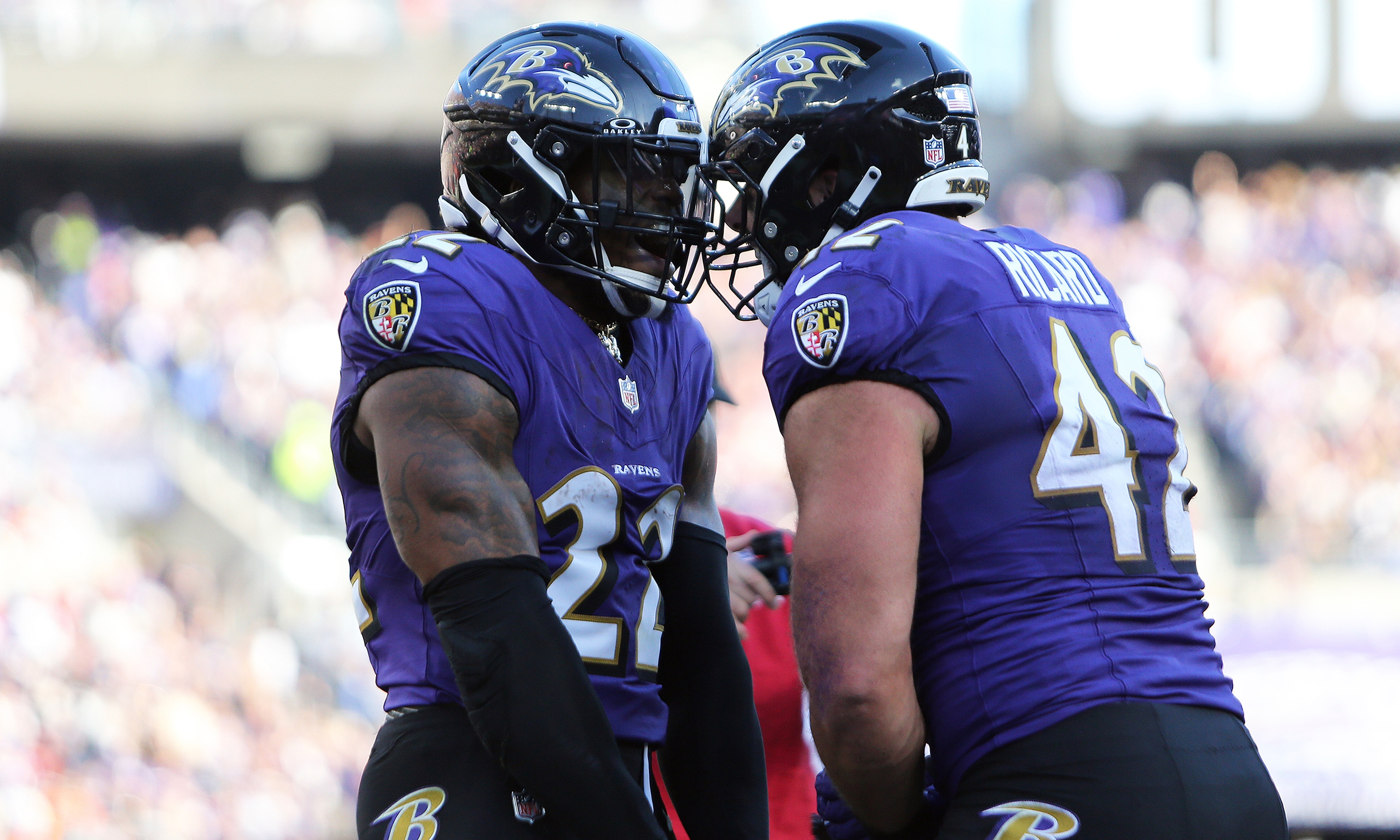 Baltimore Ravens running back Derrick Henry (22) celebrates with Baltimore Ravens fullback Patrick Ricard (42) during a game against the Denver Broncos.