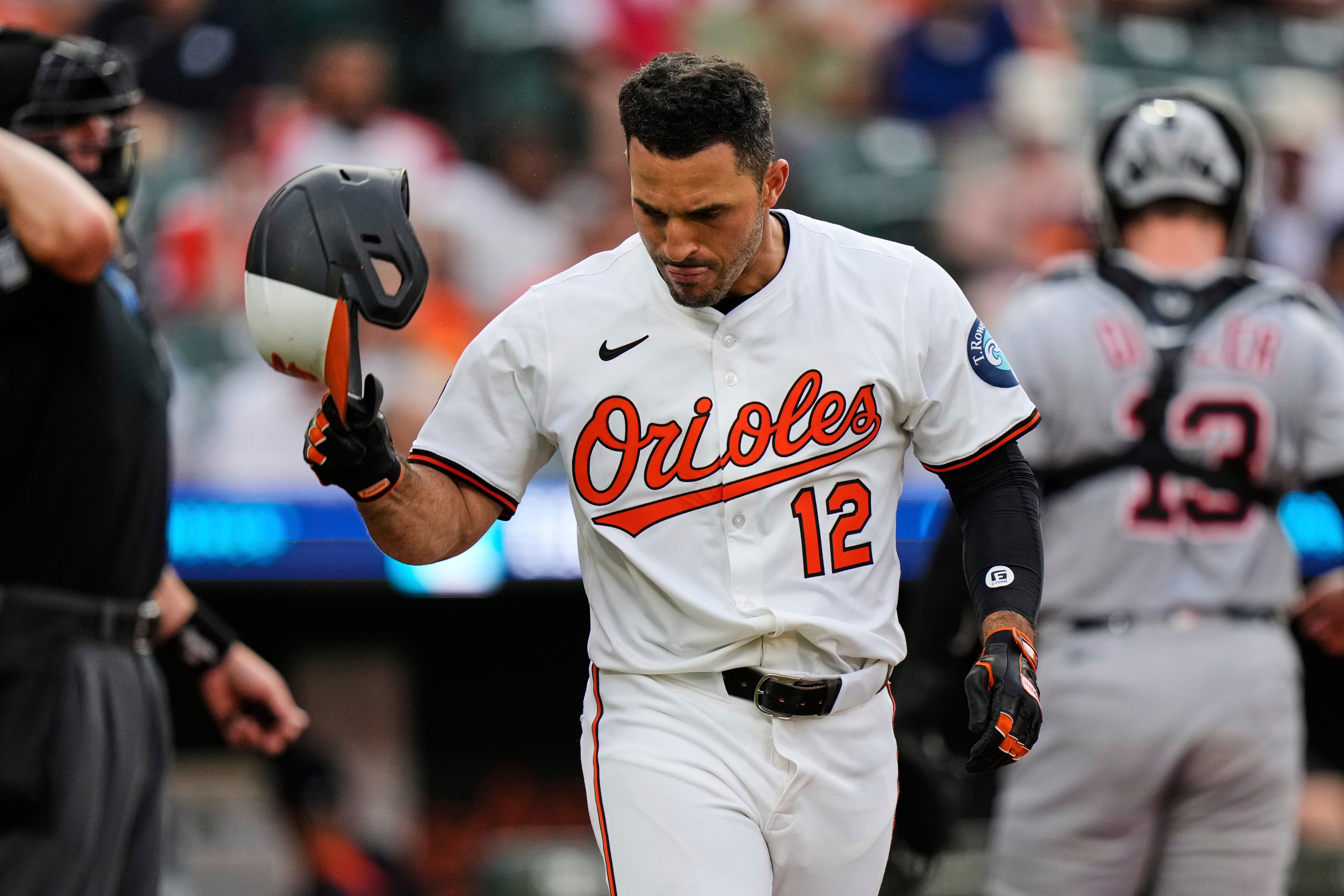 Baltimore Orioles' Ramon Laureano (12) throws his helmet to the ground after striking out during the third inning of a baseball game against the Detroit Tigers, Tuesday, June 10, 2025, in Baltimore. (AP Photo/Stephanie Scarbrough)