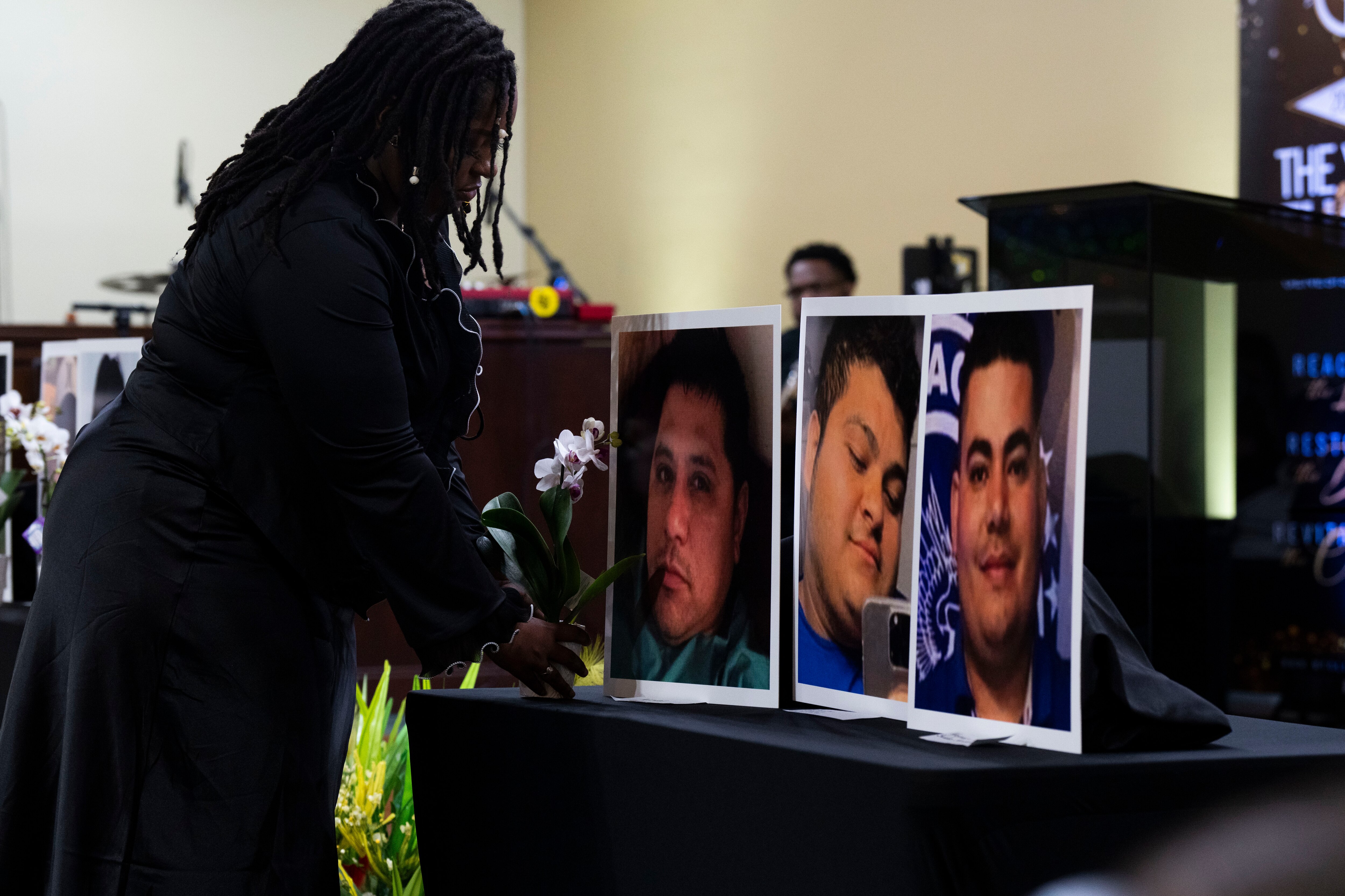 At a memorial event on Wednesday at Mt. Olive Baptist Church of Turner Station, flowers are placed in front of the photos of the six men who died last year.