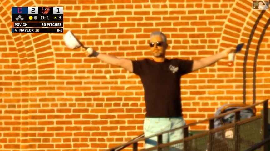 Tim Byer, a pastor from Anne Arundel County, reacts after making a one-handed grab at Oriole Park. (Broadcast screenshot from MLB.com)