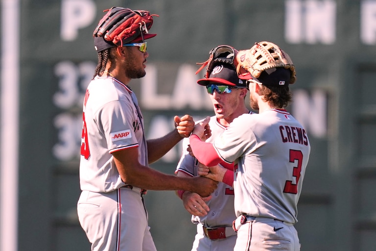Washington Nationals' James Wood, left, celebrates with Dylan Crews (3) and Jacob Young, center, after defeating the Boston Red Sox following a baseball game, Wednesday, July 1, 2026, in Boston. (AP Photo/Charles Krupa)