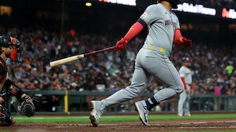 Washington Nationals designated hitter Luis García Jr. hits an RBI single during the sixth inning.