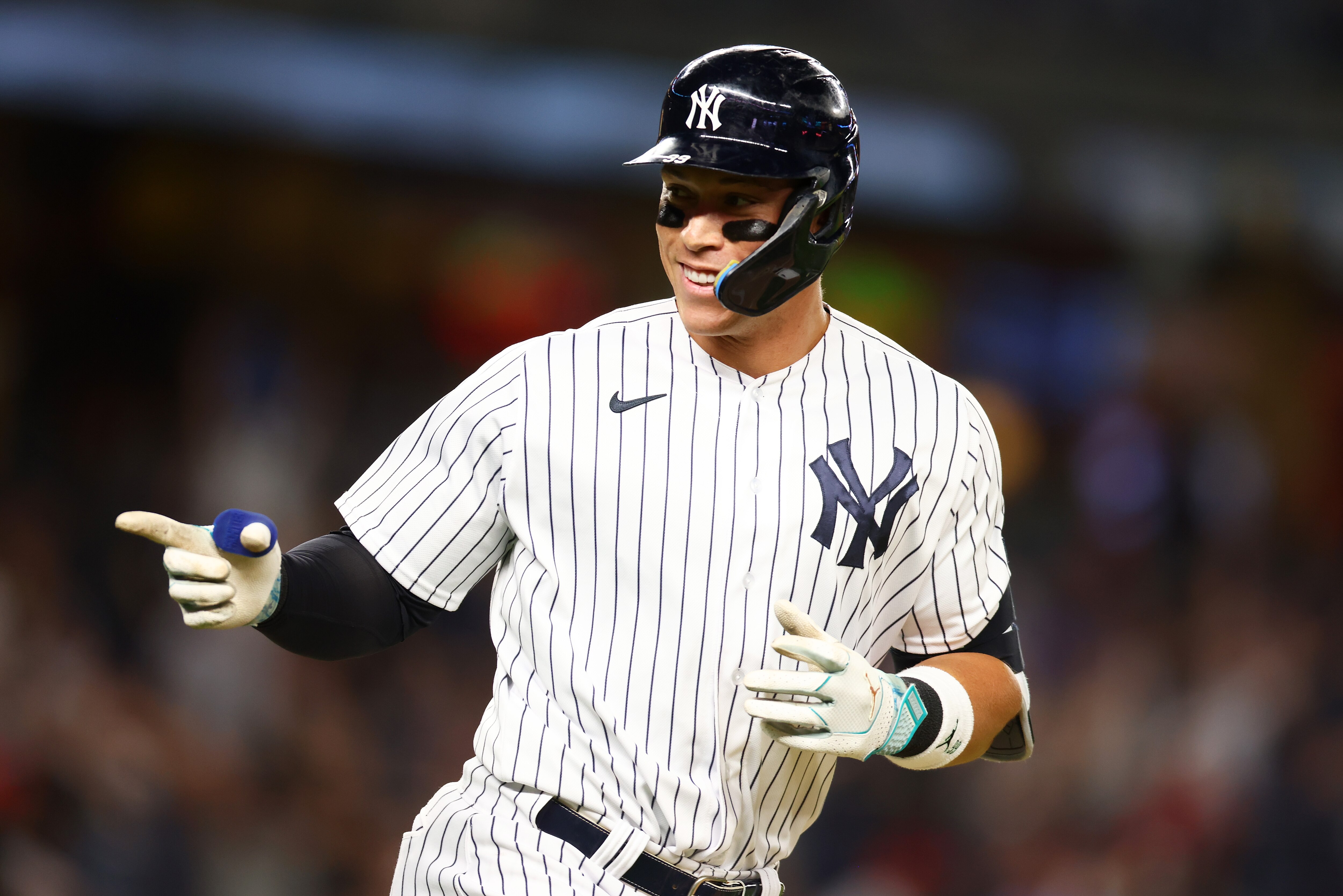 NEW YORK, NEW YORK - AUGUST 23: Aaron Judge #99 of the New York Yankees points to the dugout after hitting his third home run of the game against the Washington Nationals at Yankee Stadium on August 23, 2023 in the Bronx borough of New York City. (Photo by Mike Stobe/Getty Images)