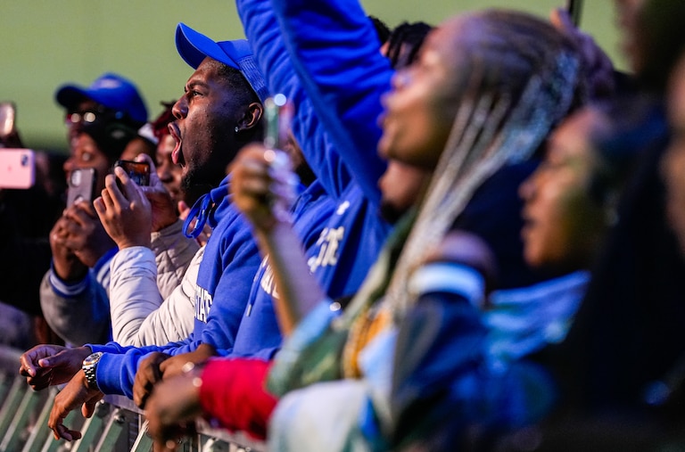 Fans cheer on the Fayetteville State University Marching Bronco Xpress band during Fan Fest at the Baltimore Convention Center on Friday, March 1, 2024.