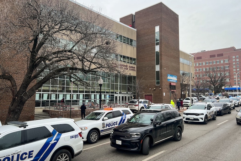 Police vehicles outside of Baltimore's Dunbar High School on Wednesday after a report of an armed person.