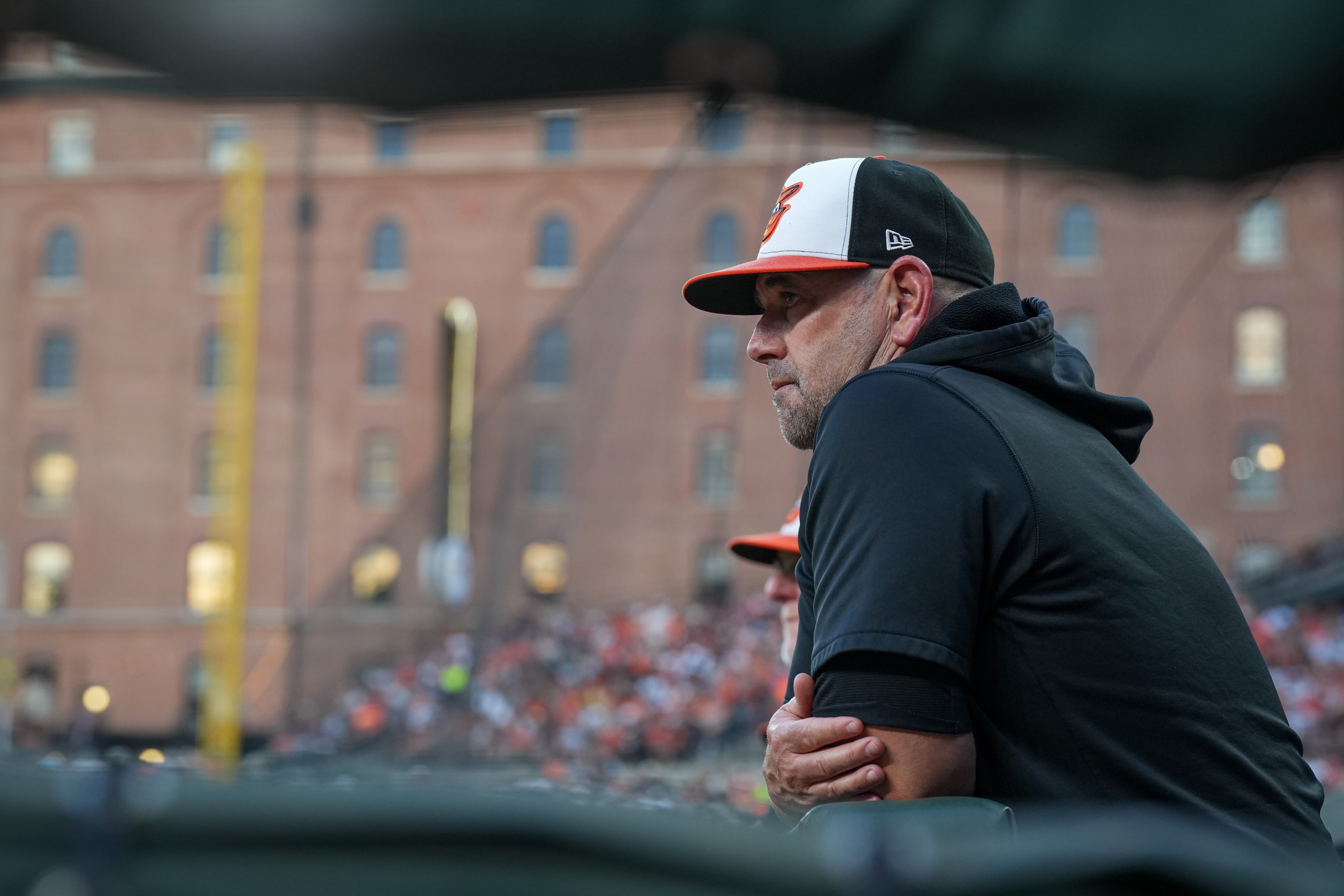 Baltimore Orioles manager Brandon Hyde watches his team from the dugout during the second inning of a baseball game against the Colorado Rockies at Camden Yards on Saturday, August 26.