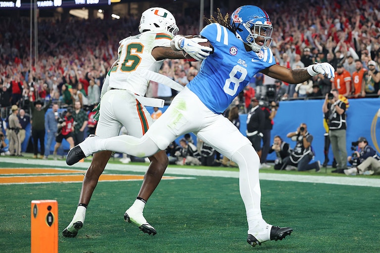 Ole Miss tight end Dae'quan Wright catches a touchdown defended by Miami's Jaboree Antoine in the fourth quarter during the 2025 College Football Playoff Semifinal on Jan. 8.