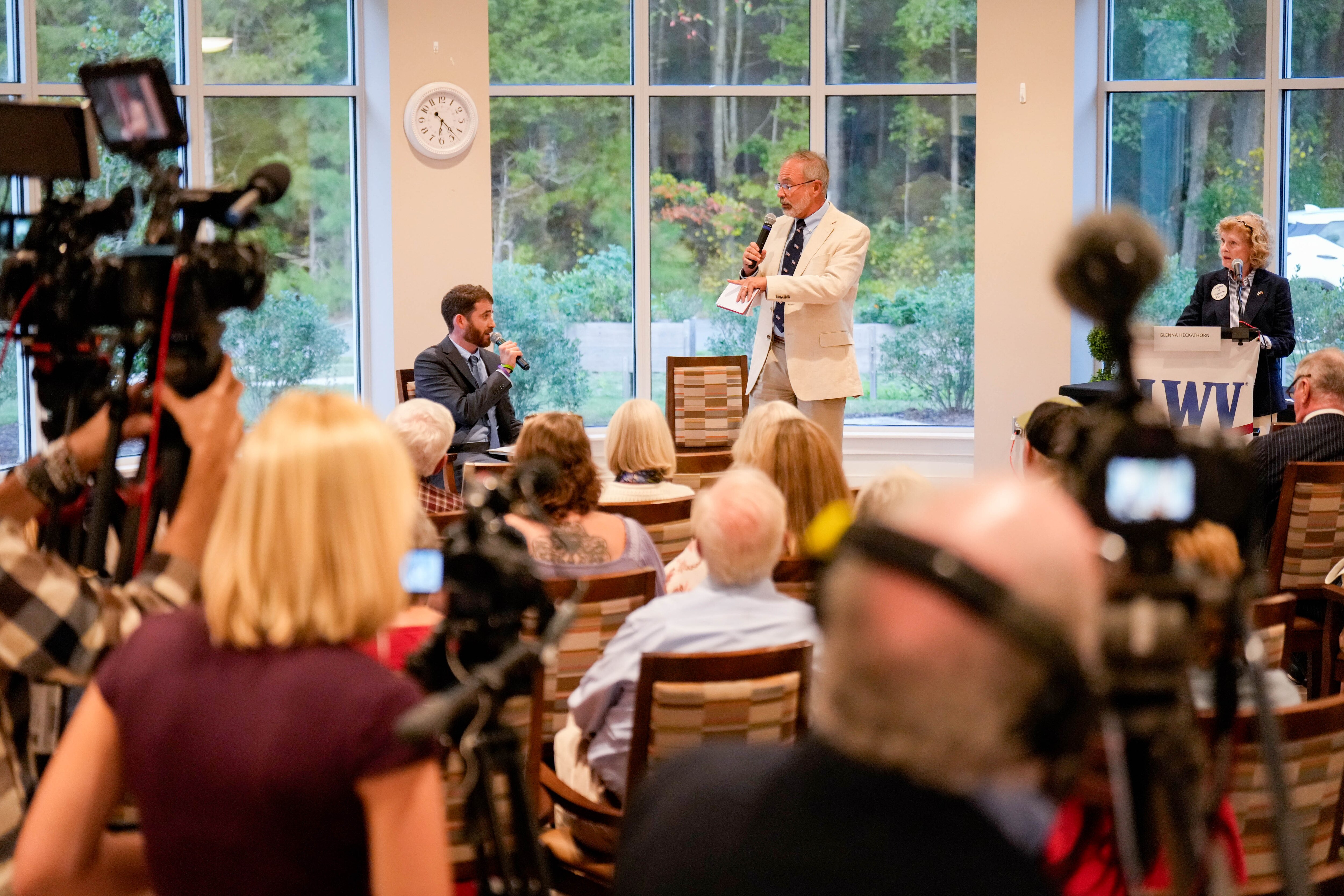 U.S. Rep. Andy Harris, right, and Democratic candidate Dan Schwartz exchange remarks during a League of Women Voters forum in Cambridge on Tuesday.