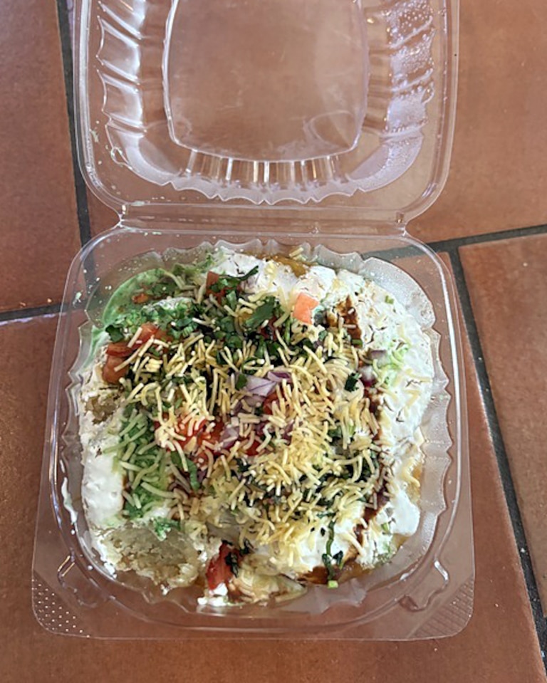 Aloo Tikki Chat, a street food dish of potato patties smothered in chutneys and covered in chickpeas, at Mount Everest restaurant, is an appetizer. But it’s so good you might not want to share it.