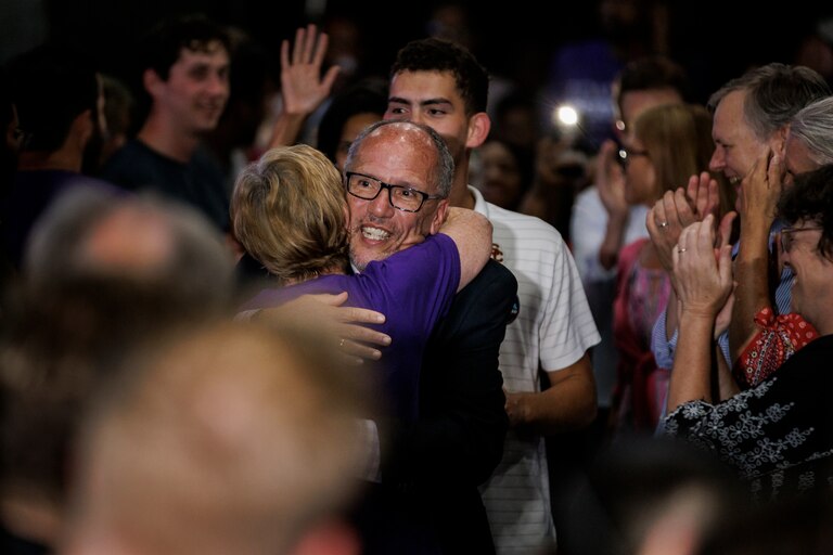 Tom Perez hugs a supporter as he arrives with Shannon Sneed for a primary election night event at Tommy Joe's on July 19, 2022 in Bethesda, Maryland. Perez, the former U.S. Labor Secretary under President Barack Obama and a former Democratic National Committee chairman, is running for governor.