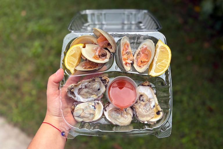Oysters and clams on the half-shell are served with lemon and hot sauce at Happy Times Seafood.