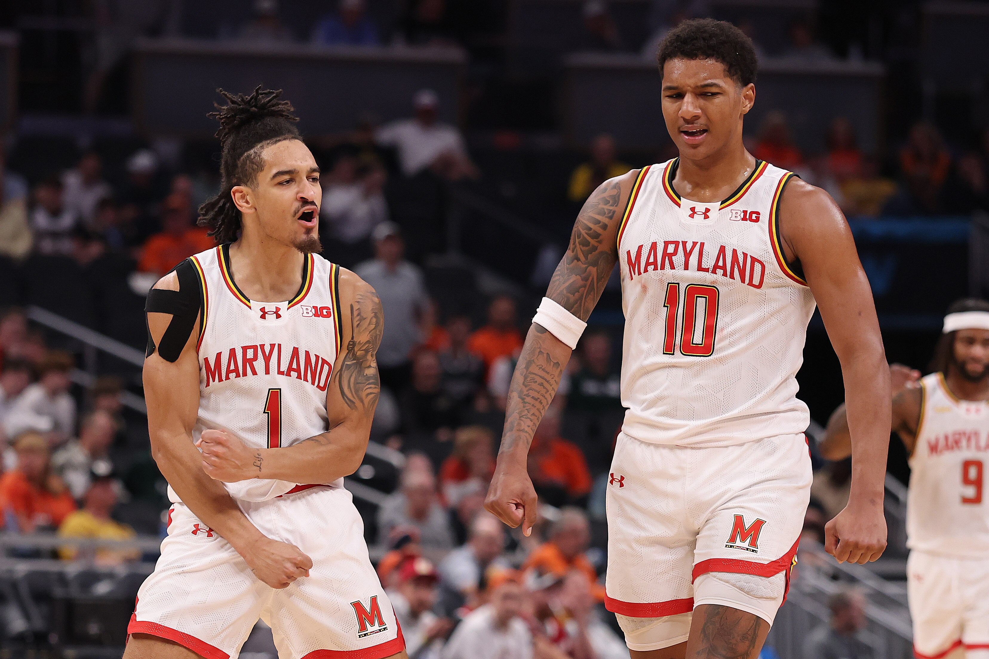 Rodney Rice, left, and Julian Reese of Maryland celebrate a score during the first half of the Terps’ Big Ten quarterfinal win over Illinois on Friday night in Indianapolis.