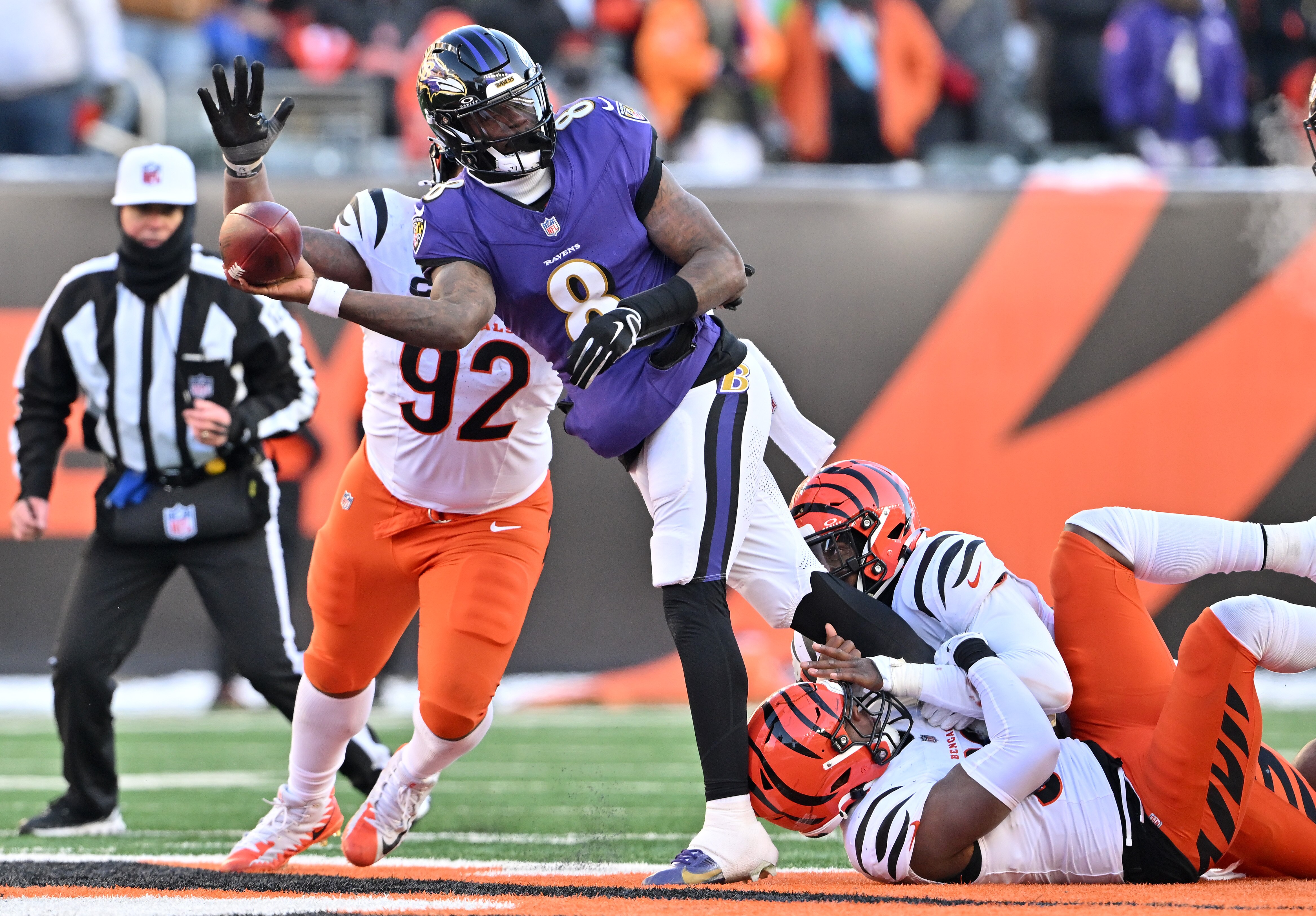 Ravens quarterback Lamar Jackson throws under pressure during the third quarter against the Cincinnati Bengals.