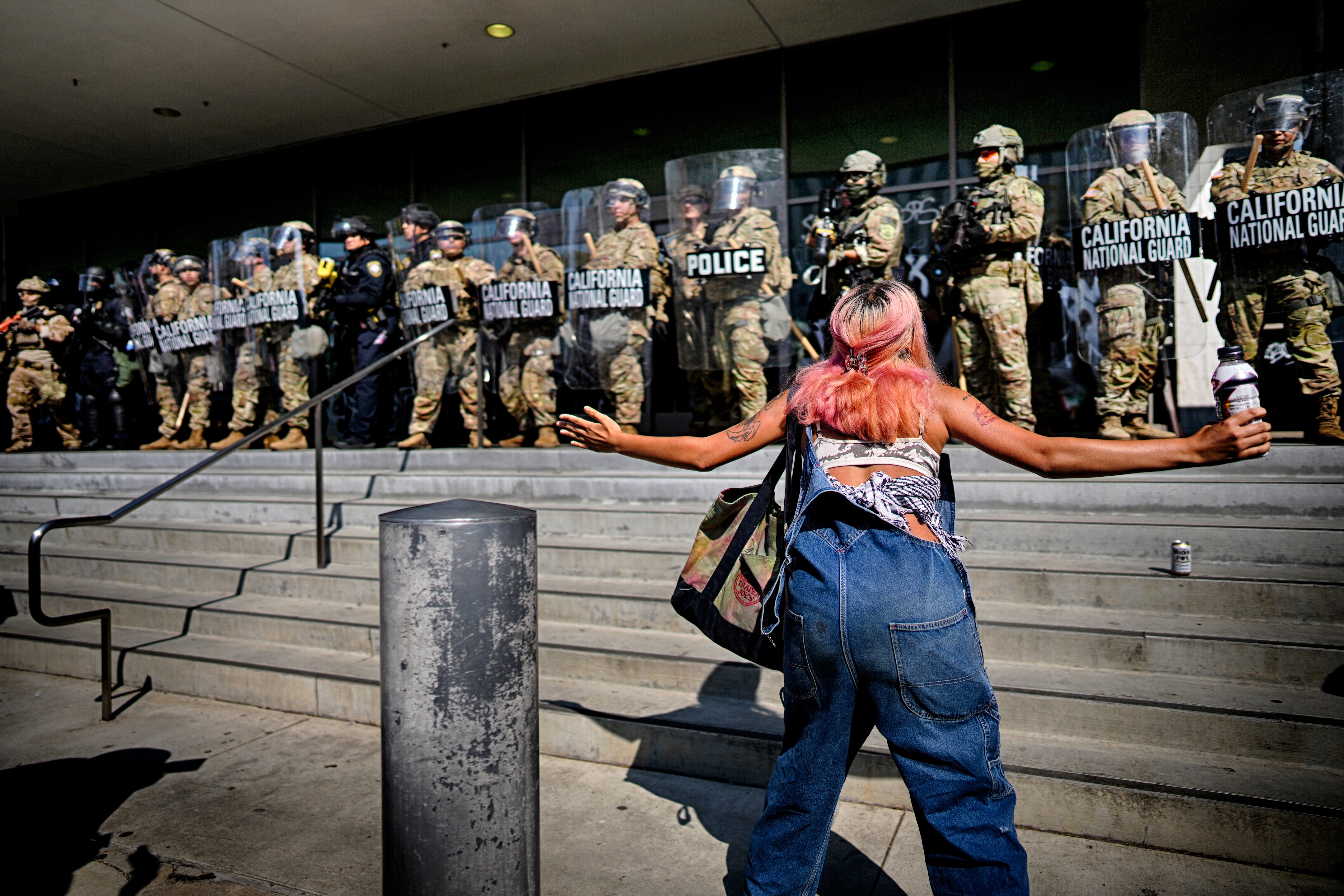 A protester taunts a line of California National Guard protecting a federal building in downtown Los Angeles on Monday, June 9, 2025.